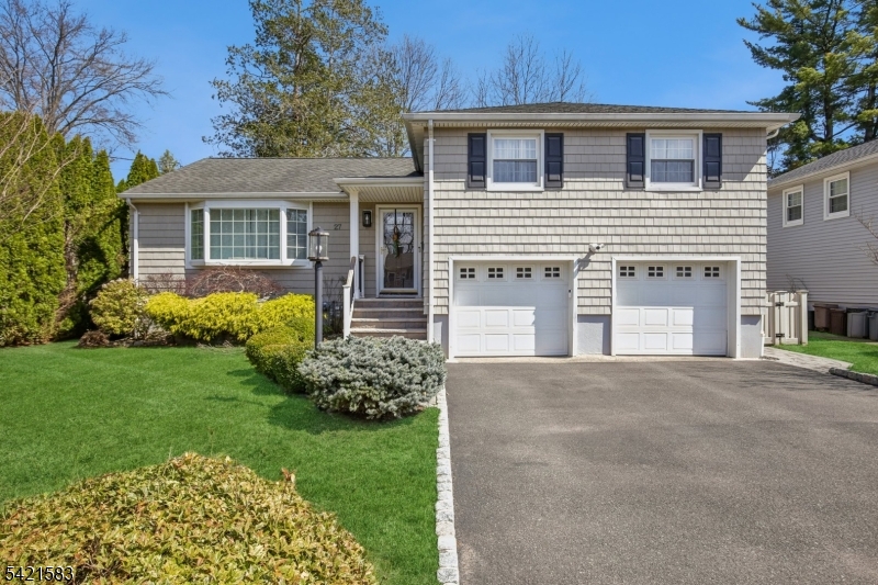 Located in the highly sought-after Garden Oval, this beautiful split-level home offers great curb appeal, modern updates, and a park-like setting. Step inside to find a bright and inviting living room that flows seamlessly into the formal dining room. The dining room leads to a large deck overlooking a fully fenced backyard with firepit and a patio below. Upstairs are three bedrooms including a primary suite with a walk-in closet and bathroom. The ground level includes a family room with access to the two-car garage and backyard, while the basement provides ample storage and laundry. Recent upgrades include smart garage openers, EV charger, security cameras, outdoor electrical outlet, smart smoke & carbon detectors, and a built-in outlet for a Frame TV.Ideally situated near premier shopping, transportation, and major highways enjoy easy access to local grocery stores, shops, and NJ Transit all within 10 minutes. This turnkey Garden Oval residence combines comfort, style, and smart enhancements with spacious living areas and a serene outdoor setting, all in a location that makes commuting and everyday errands effortless.