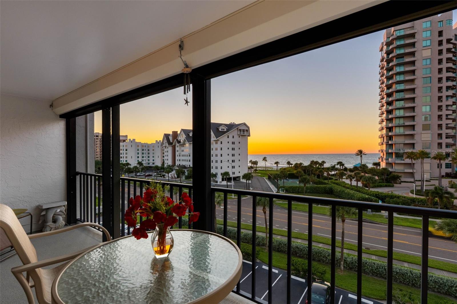 Enjoy the best of boating and beach living on Sand Key in Clearwater, Florida. This fully furnished two-bedroom, two-bath waterfront condominium features a deeded deep-water boat slip, Gulf and Intracoastal Waterway views from every window. A full-length private balcony connects the living area and primary suite to the coastal surroundings, while two deeded parking spaces, including one covered beneath the building, provide added convenience.The kitchen features granite countertops, stainless-steel GE appliances, a convection oven, custom tray ceiling, and accent lighting. The primary suite offers three pass-through closets with custom built-ins and an en-suite bath featuring a split vanity, dedicated makeup area and glass-enclosed tile shower with a built-in bench. The guest bath includes dual vanities and a separate walk-in shower. Additional features include luxury vinyl plank and ceramic tile flooring, plantation shutters, motorized hurricane shutters, hurricane-rated sliding glass doors, an in-unit washer and dryer, and a new water heater installed in 2026.This unit is in the North Building with unlimited views. Community amenities include two swimming pools, fishing pier and a secured lobby entrance, with public beach access directly across Gulf Boulevard to Sand Key's sugar-sand shoreline. Enjoy nearby waterfront dining at Backwaters and Columbia Restaurant, while the restaurants, shopping and entertainment of Clearwater Beach are accessible by bicycle or trolley. The building has completed and passed all required milestone inspections.