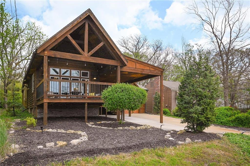 This upper-tier home offers a warm and inviting open floor plan. Appealing features include charming curb appeal, a vaulted ceiling with beautiful wood accents, abundant kitchen cabinets plus a custom bar top, and an impressive, large primary bath.  Outdoor features include a private backyard and a beautiful covered deck with room for you and your guests to enjoy the fabulous Lotawana sunsets and the main channel views. Main-body docking in deep water provides the best seat ever to watch the Lotawana fireworks display.  Conveniently located just across the dam, allowing ease of access on and off the lake.
