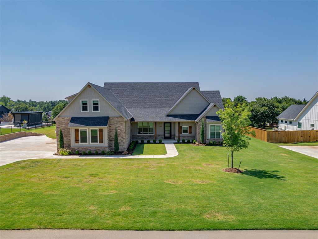 Why wait on a new build when this almost new designer-inspired home is ready now? It's packed with high-end features most buyers only dream of adding after move-in. 
Set on a beautifully landscaped .75 acre lot, this meticulously maintained home blends thoughtful design with over $60K in custom upgrades. 
Step inside and feel the difference—elegant custom drapes and shades, luxe finishes throughout and a layout designed for comfort, flexibility, and effortless entertaining.
The star of the show? A tiled, covered patio with mechanical screens and disappearing doors that extend your living space for seamless indoor/outdoor living. With a gas fireplace, dual ceiling fans, and an additional grilling area, it’s a true showstopper ready for year round enjoyment. 
Inside, you’ll find a thoughtfully designed main level featuring a private pocket office, three generously sized bedrooms, and a dreamy primary suite with a spa-style bath and custom walk-in closet. Upstairs, a large flex space with a full bath offers endless possibilities—guest suite, creative studio, second living area—you decide!

Additional luxury features include:  private well and whole house water filtration and softener system. Foam insulation, tankless water heater, and 6-ft in-ground storm shelter. Full-home fiber, CAT6, and coax wiring — including patio & garage. 3-car oversized fully insulated garage (approx. 1000 sf) with utility sink and turf in the third bay. This is ideal for a gym, golf practice, or hobby zone. The garage is HVAC-ready, with space for a window unit to easily heat or cool as needed. The list goes on, smart home ready infrastructure, backup generator, landscape lighting, & gorgeous curb appeal. 
All this and less than 10 minutes to oak tree golf club and about 5 miles to I-35 and 15 minutes to  all your everyday conveniences — everything you need without sacrificing peace, privacy, or space. Edmond Schools and Shop Appproved!