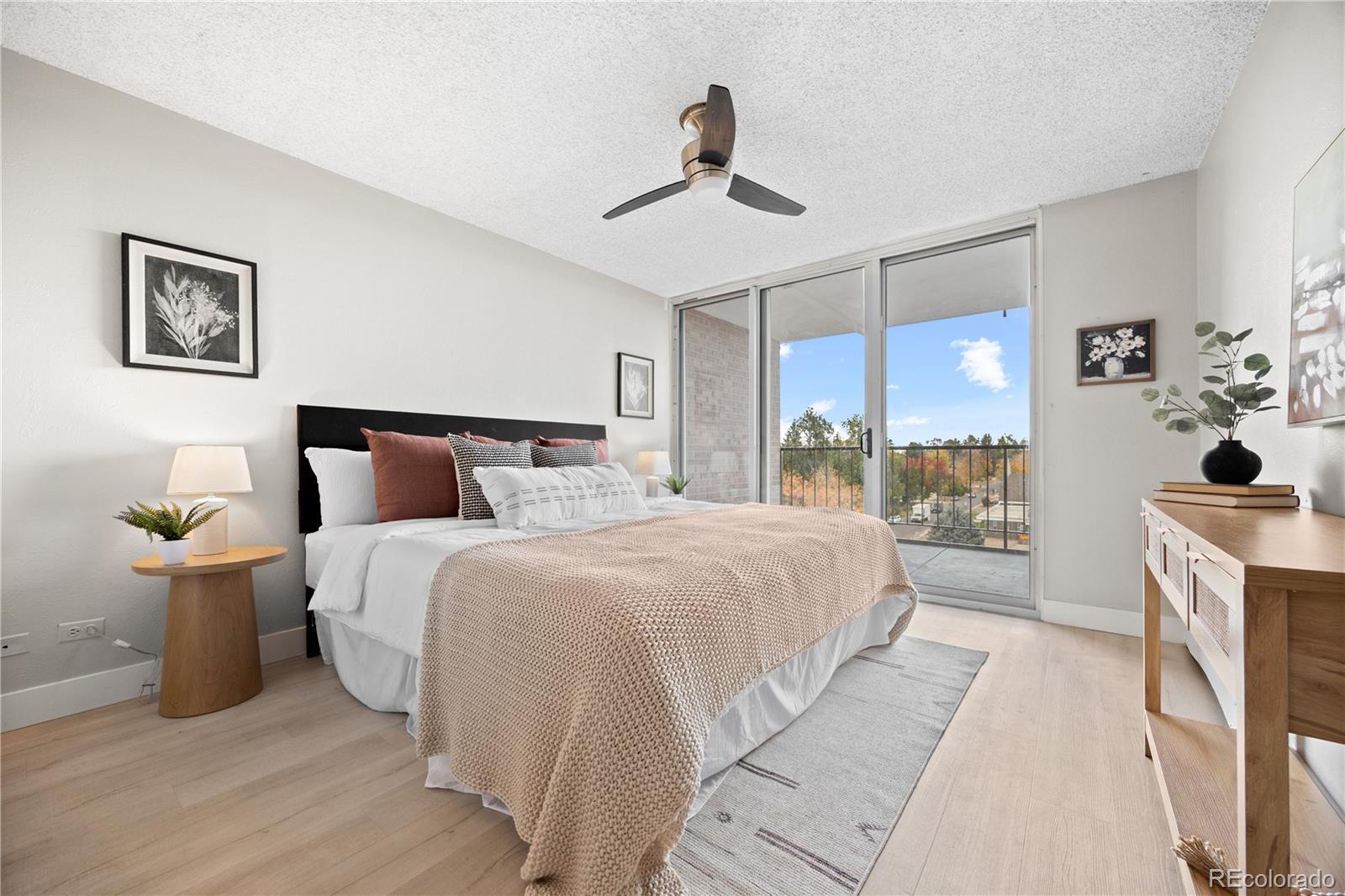 Beautifully Updated Park Mayfair Condo with Mountain Views! Welcome home to this beautifully updated 1-bedroom condo on the 5th floor of Park Mayfair, offering sweeping northwest mountain views and a bright, open layout. Floor-to-ceiling windows fill the spacious living and dining areas with natural light, while the modern kitchen features soft-close gray cabinetry, quartz countertops, and updated appliances. Luxury plank flooring runs throughout the entire home, leading to a large bedroom with plenty of space for a king-sized bed, a generous walk-in closet, and a second set of sliding glass doors to the 23-foot covered balcony — the perfect place to relax and take in the sunset. The updated bathroom includes a marble-topped vanity with soft-close drawers and a classic subway-tiled shower/tub combination. Park Mayfair’s amenities truly set it apart: enjoy an indoor pool, fitness center, and dry sauna right inside your building — ideal for cozy winter days. When the weather warms, head outside to the beautifully refreshed courtyard with an outdoor pool, built-in grill, and lounge areas. This unit also includes a deeded garage parking space (#11), a separate storage unit, and convenient access to the on-floor laundry room. The building is currently receiving a stylish exterior refresh, fully funded by the current owners — so you’ll enjoy the benefits for years to come. All this, just steps from Rose Medical Center and moments from the fantastic shops, restaurants, and entertainment at 9th & Colorado, including Trader Joe’s, AMC, Postino, and Culinary Dropout.