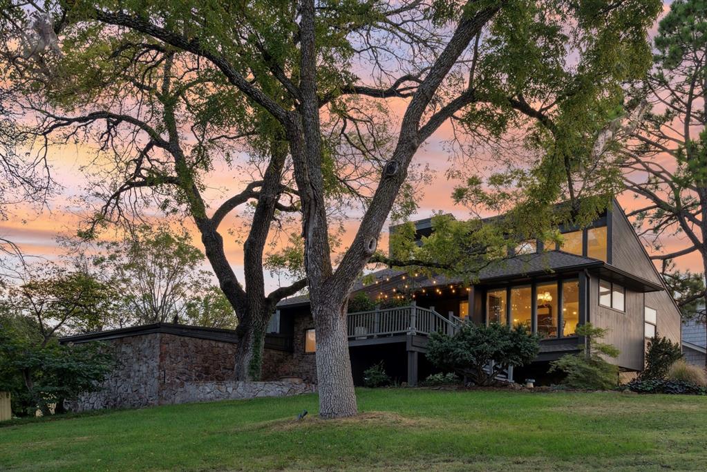 This organic modern home is designed for the rhythms of real life. It’s a place to gather, work, create, and rest. 

Perched atop a rolling hill with expansive views, it offers a balance of elevated design and everyday Hygge comfort. The multiple levels are nestled into the hillside, creating private corners and unexpected views. With three indoor and three outdoor living spaces, four bedrooms, and two and a half bathrooms, the layout is practical without feeling predictable.

The home opens to soaring skylight-filled ceilings. The light-filled space is automatically shielded at dusk by shades that awaken at dawn.  The spacious updated kitchen boasts Brazilian quartzite countertops and custom inset soft-close maple cabinetry. At the center of the home, the living room opens to accommodate gatherings with many conversational spaces, and an additional space for media, a playroom, or studio. Hardwood hickory flooring carries throughout the main living areas, grounding the modern lines with warmth.

Moving down the stairs, a landing—with a view of the large front hill and trees—adds additional space for recreation or work. Continuing down, a partially subterranean sleeping-level exudes stillness and calm for the four bedrooms and two full baths. 

Step outside to three distinct patio areas, each with its own mood—morning coffee in the sun, family meal, quiet evening under the stars. Two oversized driveways add to the convenience, with plenty of parking that doesn’t disrupt views.

Located in the Monroe School District with quick access to Hwy 9 and I-35, the setting is both connected and tucked away. It’s close enough for an easy commute, yet far enough to retreat at the end of the day.

This home is current, yet enduring. And it is ready for its new steward.