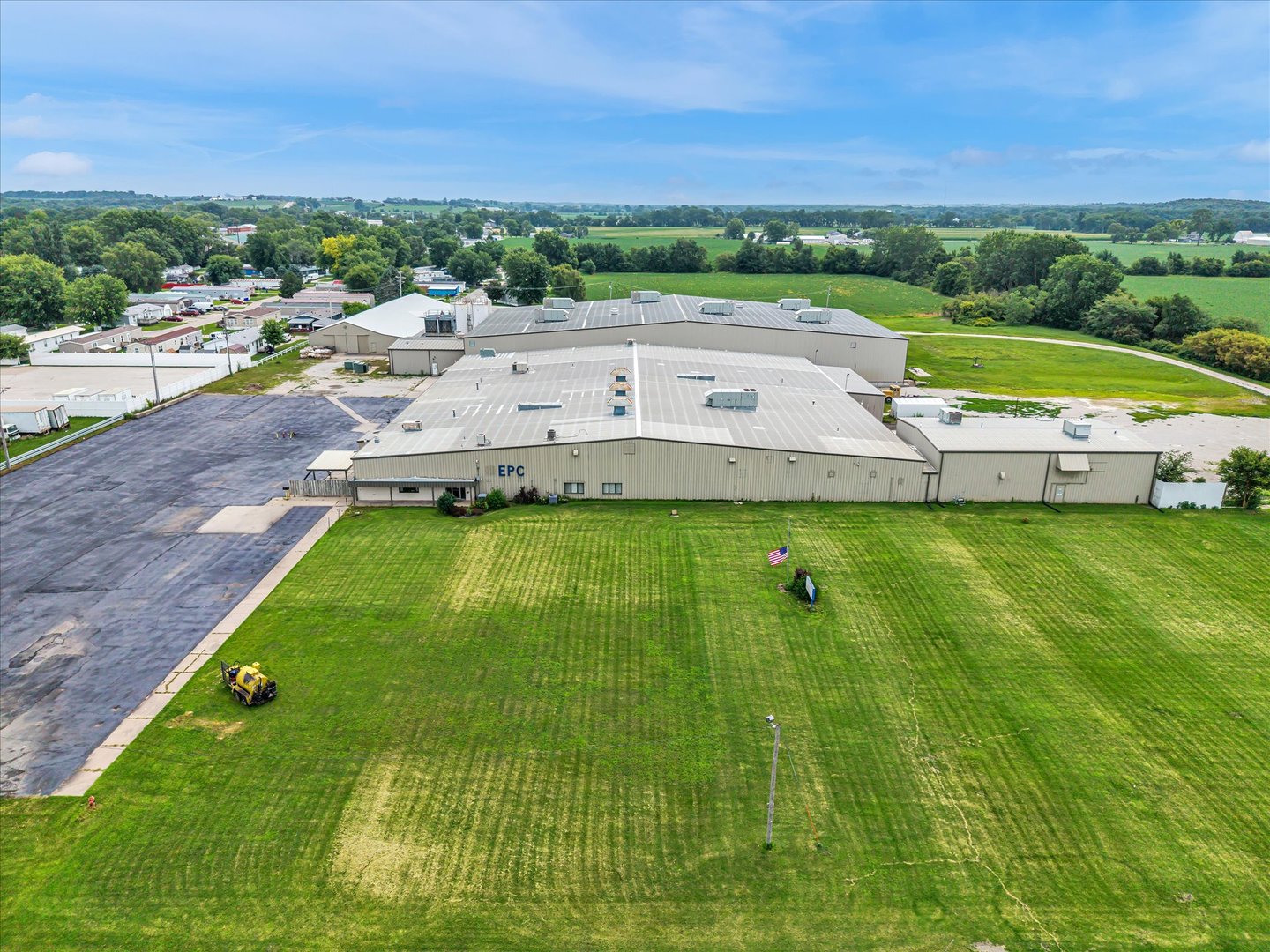 Rare opportunity to acquire a 108,475 SF industrial manufacturing complex in Kalona, Iowa, offering substantial existing infrastructure for heavy manufacturing, fabrication, distribution, or specialized owner-user operations. Building #1 features ceiling heights ranging from approximately 15'3" to 20'3", sprinkler coverage, radiant heat, climate-controlled areas, a crane-equipped tool room, 480V 3-phase power, bus ducting, and capacitor banks supporting exceptional electrical efficiency, along with seven overhead doors and five dock doors. Building #2 consists of approximately 40,000 SF and features ceiling heights reaching approximately 35' with 25' sidewalls, 10-ton and 15-ton cranes, and a dedicated water cooling system, providing exceptional functionality for heavy manufacturing and fabrication users. Building #3 includes approximately 10,000 SF of cold storage and two additional dock doors, providing flexibility for storage and distribution operations. The property is served by two water meters and one gas meter and also includes an additional 8-acre parcel currently utilized as farmland, offering potential for future expansion, outside storage, or additional industrial use. With significant power, crane capacity, loading functionality, and specialized manufacturing infrastructure already in place, this property represents a unique industrial opportunity in Southeast Iowa.
