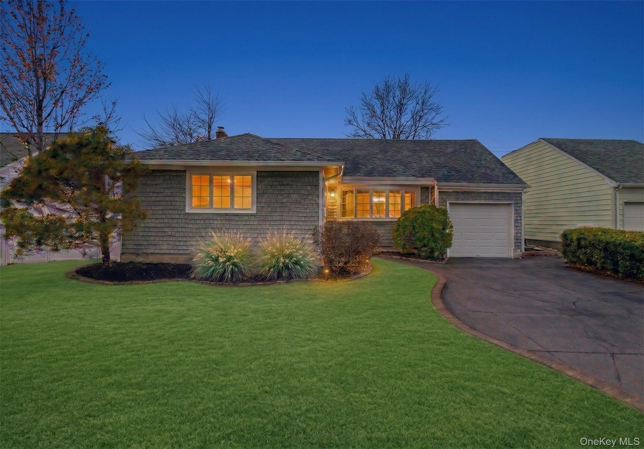 Welcome to this beautifully just renovated 3/4 bedroom home nestled in the heart of Bethpage — move-in ready and full of stylish upgrades from top to bottom with LOW TAXES!  Stunning new vinyl siding with faux cultured stone accents on the front of the home provides exceptional curb appeal and lasting durability, setting the tone for everything you'll find inside. The brand-new galley-style eat-in kitchen is a true showstopper, featuring crisp white cabinetry, gorgeous quartz countertops, a beautifully tiled backsplash, and new high-hat lighting — every detail thoughtfully designed for both function and style. New luxury vinyl flooring flows seamlessly throughout the entire home, creating a bright, cohesive feel from room to room. The sun-drenched living room opens beautifully into the dining area in an airy open-concept layout, perfect for entertaining and everyday living. New high-hat lighting and stylish light fixtures add the perfect finishing touch. The primary bedroom, dining area, and living room have been virtually staged to inspire your vision and showcase the endless possibilities this home has to offer. This 3/4 Bedroom home featuring one full bath, brand new vinyl flooring throughout, high hat lights, and new lighting fixtures complete this move in ready home. Step outside to a large backyard — ideal for outdoor entertaining or your own private retreat; the possibilities are endless. A single attached garage with a brand-new garage door provides convenient, direct access to the mudroom. Stay comfortable year-round with newer central air split units, and enjoy the added convenience of a spacious side mudroom that connects seamlessly to the kitchen and leads to a large basement. Newer roof  **Photos have been virtually staged