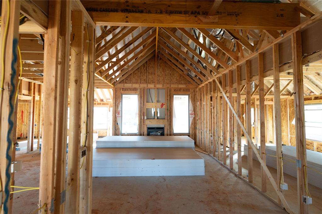 This Hummingbird Bonus Room 1 floor plan includes 2,495 Sqft of total living space, which includes 2,250 Sqft of indoor living and 245 Sqft of outdoor living space. This home offers 4 bedrooms, 3 full bathrooms, a utility room, a bonus room, and a 3-car garage with an in-ground storm shelter installed. The great room embraces a gas fireplace with a stacked stone detail, large windows, wood-look tile, Cat6 wiring, rocker switches throughout, and a flawless cathedral ceiling with a ceiling fan. The up-scale kitchen has stainless-steel appliances including a 5-burner cooktop, decorative tile backsplash, 3 CM countertops, a large center island with a trash can pullout, stellar pendant lighting, well-crafted cabinets to the ceiling with under cabinet lighting and cabinet hardware installed throughout, and a separate walk-in pantry. The prime suite boasts a sloped ceiling detail with a ceiling fan, windows, and our cozy carpet finish. The prime bath supports a dual sink vanity with framed mirrors and 3 CM countertops, a walk-in shower, a free-standing tub and TWO walk-in closets. Secondary bedrooms feature high ceilings with a ceiling fan, windows, sizeable closets, and carpeted flooring. The covered back patio includes an outdoor wood-burning fireplace, a gas line, and a TV hookup. Other amenities include our healthy home technology, an air filtration system, a tankless heater, R44 insulation, and more!