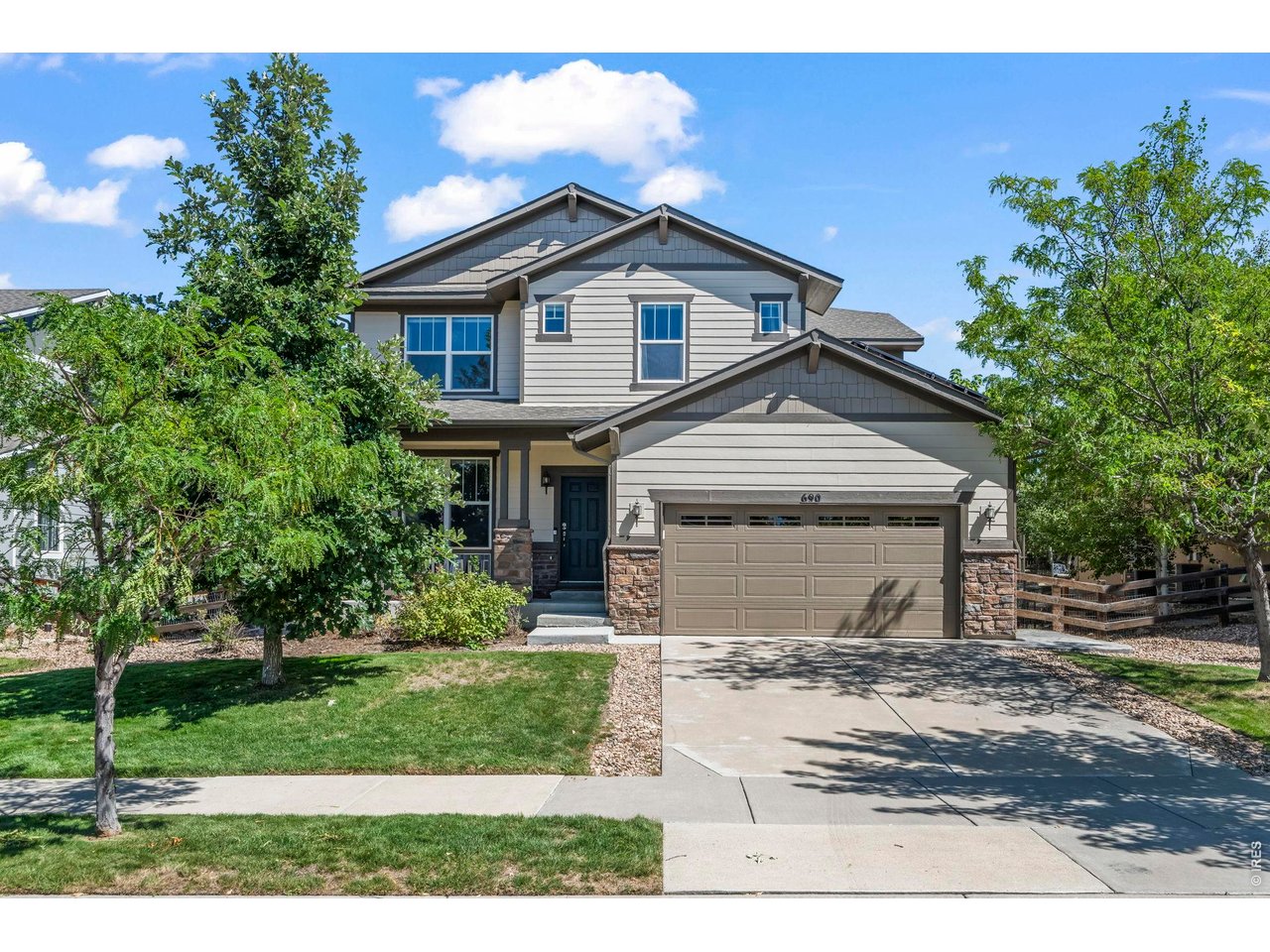 Modern appointments meet exceptional functionality in this spacious, beautifully updated home just steps from the highly desirable Meadowlark K-8 school. From the moment you enter, upgraded lighting, newer paint and carpet, and sleek contemporary finishes create a fresh, inviting feel throughout. A convenient main-level office provides the perfect work-from-home space, while the drop zone off the three-car garage (with EV charger) keeps everyday life organized.The heart of the home is the stunning modern IKEA kitchen featuring quartz countertops, stylish tile backsplash, upgraded appliances, induction cooktop, sleek vented hood, drawer microwave, generous pantry, and thoughtfully designed cabinetry with lighted cabinets and drawers. The kitchen opens seamlessly to the expansive great room, highlighted by a dramatic tiled gas fireplace wall and plenty of space for gathering and entertaining.Upstairs, a large loft offers additional flexible living space. The spacious primary suite feels like a true retreat, complete with a bonus sitting area, modern five-piece bath with heated floor, and walk-in closet. Two additional bedrooms share a convenient Jack-and-Jill bath. The finished basement continues the home's modern style with contemporary railing, a spacious media room, wet bar, two additional bedrooms, and a three-quarter bath with heated floors and lighted mirrors. The oversized (6th bedroom) makes a great gym or flex space. Outside, enjoy Colorado living on the expansive stamped-concrete patio with a covered gazebo and hot tub-an ideal setting for relaxing or entertaining. The home offers a nearly $40,000 dual A/C and heat (and water heater)-pump system combined with a fully paid-off solar system to help dramatically reduce electric and gas costs. With modern finishes at every turn, abundant flexible living space, impressive energy-efficient upgrades, and an incredibly convenient location, this home truly offers the complete package.