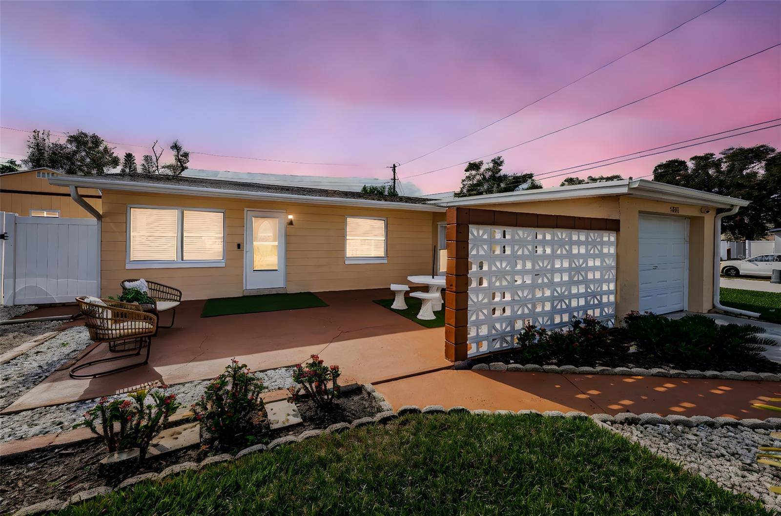 Renovated Home with Numerous Upgrades. This meticulously maintained home has undergone a major renovation, making it a true gem, located walking distance from parks, schools and the Pinellas Park Arts District as well as the nearby England Brothers Park featuring numerous concerts and events. A hurricane-standard roof was installed in March 2023, New Electrical Panel 2023, and a new AC system was installed in 2021, complete with UV filtration to ensure fresh and clean air throughout the home. Additionally, new AC ducting was installed in April 2023, optimizing the efficiency and airflow of the cooling system.  Inside, the house features new flooring, a fully upgraded kitchen, and modernized bathrooms. The kitchen is equipped with all stainless steel appliances, and showcases elegant quartz countertops. The home's interior is light-filled and spacious, with versatile multi-use spaces that provide endless possibilities for customization. In addition to the living room and dining area, a large den offers a flex space for all of your activities and hobbies. Full size stacked brand-new Samsung washer and dryer are located in the spacious laundry room. The exterior of the property boasts a new vinyl fence, installed in April 2023, which encloses a spacious yard adorned with a 1-year old Swim Spa, a delightful gazebo, situated on a concrete pad, offering a peaceful retreat. Brand new gutters with leaf guards ensure low maintenance. Florida Shed with hurricane tie downs and a loft installed in 2024. Throughout the home you'll find charming wood accents, including a barn door, accent barnwood shelving, and a solid wood front door, adding a touch of rustic elegance. Large master suite with sitting area and TONS of closets. High end master bath with dual sinks,  luxury shower and lighted mirrors. The front of the property boasts an enormous patio with privacy walls, creating a private outdoor space for entertaining or relaxation. The one-car garage is equipped with an opener and has AC ducting, allowing for multiple uses beyond just parking. This well-located, renovated home on a large lot presents a wonderful opportunity to own a property that combines modern upgrades with appealing features, creating a comfortable and inviting living environment. Have an RV or a boat? No problem. Place to park it is ready for you, in addition to extra parking beside expanded driveway. Come see how this could be the perfect fit for you and your toys or hobbies. Does not require flood insurance and in Evacuation Zone D.
