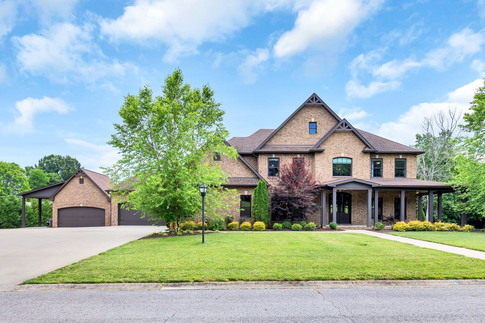 Magnificent estate sitting on a perfectly level 5+ acre lot. 5BD|4BA all brick home with a half bath in the covered pool room. Absolutely no expense spared throughout this home with hardwood flooring, a completely custom kitchen, and countless upgrades in every single room. 6 car garage (4 attached and 2 detached) with an oversized carport for a boat or RV.  The pool is a massive 20x40ft underground pool with 4 deck jets and lighting. Covered pool house with a closet, pantry and storage. HVAC and water heater installed! Custom built brick fireplace. Custom built Pine Pergola with a brick fireplace, metal roofing, side bar and railings. This is a turn key absolutely one of a kind home that is worth seeing in person. Willing to sell furnished for an additional fee.