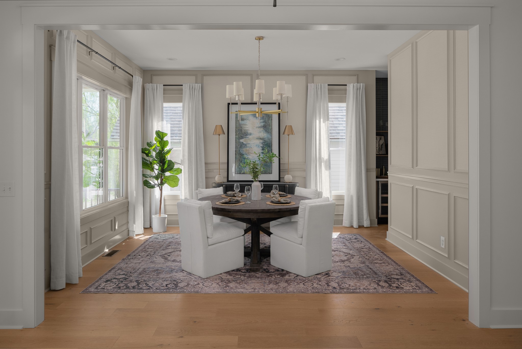 Welcome to 1912 Eastside Avenue — where timeless East Nashville character meets elevated, intentional design. This nearly 4,000 square foot residence (plus a fully finished 492 SF accessory building) sits a short walk to Shelby Park, offering the best of urban walkability with the soul of a storybook neighborhood.  Designed by the talented team at Quinn & Co, every inch of this home is layered with warmth, texture, and architectural detail. Rich wainscoting with wallpaper insets, shiplap-accented bonus spaces, and natural stone counters create a home that feels curated yet comfortable. The main home features 4 bedrooms, 3 full and 2 half bathrooms, with additional spaces like a sun-filled office, a formal dining room, and a showstopping kitchen with beautiful pendants + countertops.  Enter outside to your oversized screened porch complete with your second gas fireplace or retreat to the detached flex space, complete with a wet bar and half bath. With its warm design palette, thoughtful floor plan, and unmatched location, 1912 Eastside Avenue is more than a home — it’s a love letter to East Nashville living.    *Please Note: Third floor bedroom + half bath + 492 SF is located in accessory building above 2 car garage