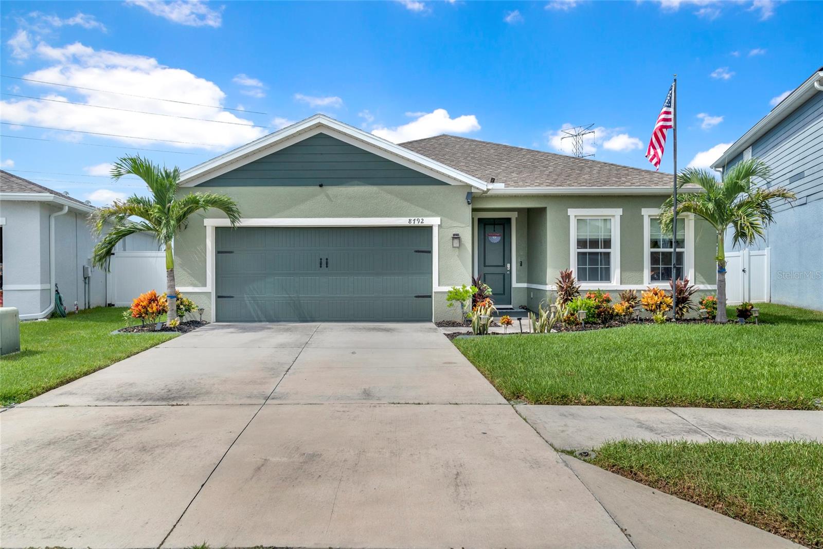 Built in 2021 and beautifully enhanced 3-bedroom, plus flex room, 2-bath, 2 car garage home in quaint Trinity neighborhood. Move in ready with over 1800 sq. ft. and a versatile flex room that can serve as an office, study, den, or potentially a 4th bedroom (with the addition of a closet). Freshly painted exterior and excellent curb appeal. The interior features tile flooring throughout the kitchen and spacious living room with custom electric fireplace and accent wall. The kitchen features 42-inch shaker-style cabinetry, granite counter tops, under-cabinet lighting, a stylish backsplash, stainless steel appliances, and a large center island.  The primary bedroom has custom-built California Closet system and an on-suite bathroom with dual sinks, quartz counter tops, and a spacious walk-in shower with built-in bench seating.  Private backyard retreat with a custom pool, covered lanai, and outdoor shower and NO REAR NEIGHBORS!  Additional upgrades include a 3.5-ton A/C system, convenient drop-down attic stairs for easy storage access. NO CDD, LOW HOA DUES, and NO FLOOD INSURANCE REQUIRED. Located in Mitchell Ranch South in Trinity, you're close to excellent schools, parks, shopping, dining, major roadways, and countless local amenities—putting everything you need within easy reach.