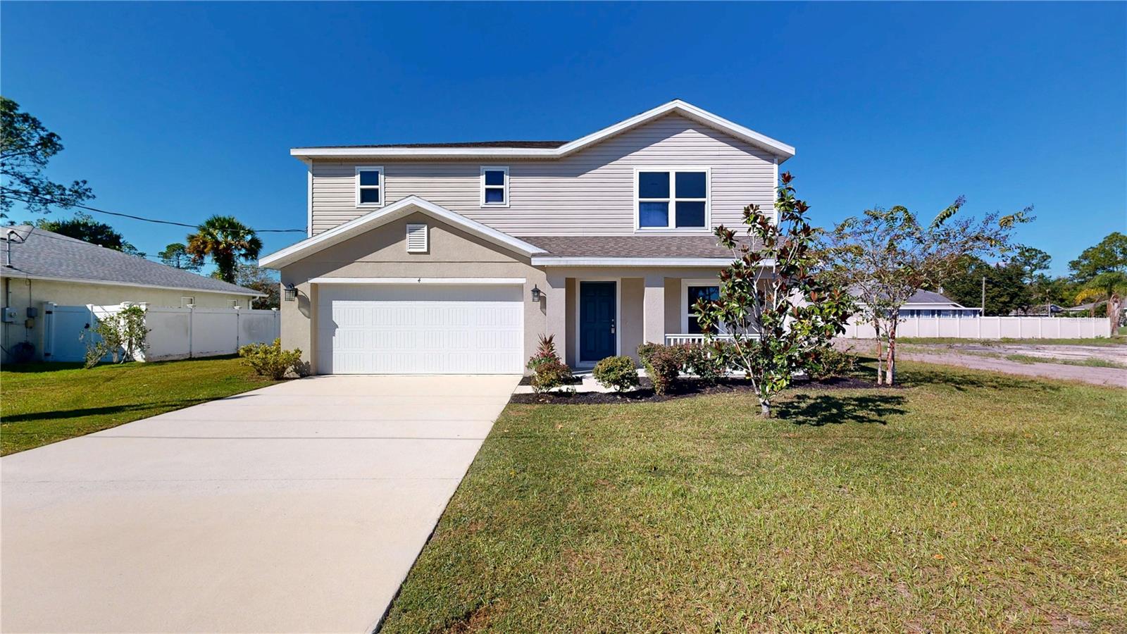 Some photos have been virtually staged. Some homes simply give you more ways to live in them and 4 Round Tree Drive is one of them. Built in 2022, this 4-bedroom, 3-bath home offers approximately 1,941 square feet of living space with a flexible two-story floor plan designed for the way you live. A first-floor bedroom with access to a full bath creates an ideal space for guests, multigenerational living, or a home office, while the upstairs loft adds even more versatility for a media room, workspace, or relaxing retreat.Step outside to a spacious backyard ready for your own vision whether that's a garden, outdoor entertaining area, summer kitchen, or exploring the possibility of a future pool. With no HOA and no CDD, you'll have even more freedom to make the property your own.Located in Palm Coast's Lehigh Woods, the home offers convenient access to shopping, medical facilities, schools, trails, I-95 and US-1, putting the best of Palm Coast within easy reach.If you're looking for a newer Palm Coast home with space, flexibility, and room to make it your own, 4 Round Tree Drive is ready for you to come take a look. You may just find that the way this home lives is exactly what you've been looking for. All information is deemed reliable but is not guaranteed. Buyers and buyers’ agents are responsible for verifying all information and performing their own due diligence.