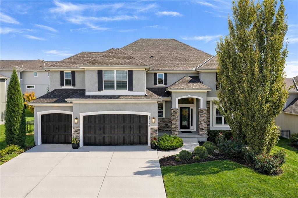 Gorgeous New Mark/Avalon with 6 true bedrooms, 5 full baths, and a finished walk-out basement with separate living quarters. The open floor plan is brightened by abundant natural daylight, featuring soaring vaulted ceilings and a multitude of windows with gorgeous window treatments, including plantation shutters. The beautiful gourmet kitchen features crisp white cabinets, quartz countertops, a huge center island, a walk-in pantry, and stainless steel appliances with a gas range and all stay, including the washer & dryer, making this truly turn-key. Enjoy special occasions in the formal dining room or sip coffee in the breakfast room overlooking the covered deck and meticulously landscaped backyard. Upstairs, you will find the Primary suite and a spa-like primary bath complete with a freestanding tub, walk-in shower, elegant tile, double vanity, and a large walk-in closet with built-in shelving. All secondary bedrooms are spacious, feature walk-in closets, vaulted ceilings, a Jack/Jill bathroom, and the guest room has a private bath. The finished walk-out basement is truly amazing, perfect for extended stay guests or separate living needs, featuring the home's 6th bedroom! It includes luxury vinyl plank flooring, a kitchenette with dining area, a family room, and a full bathroom. Other upgrades include: upgraded light fixtures, built-ins, French Doors, iron spindles, a boot bench/mudroom off the garage, and sprinkler system. The outdoor living spaces—including the covered deck and patio—are perfect for entertaining, complemented by a fully fenced yard. This home is pristine and very lightly lived in. Great location, just steps from the Park, Cedar Creek Elementary, Mission Trail Middle, and Olathe West HS. Enjoy resort-style Cedar Creek amenities: a 65-acre stocked fishing lake, indoor basketball court, 2-story clubhouse, 4 lighted tennis courts, 2 saltwater swimming pools, sand volleyball, party rooms, parks, trails, and community events.