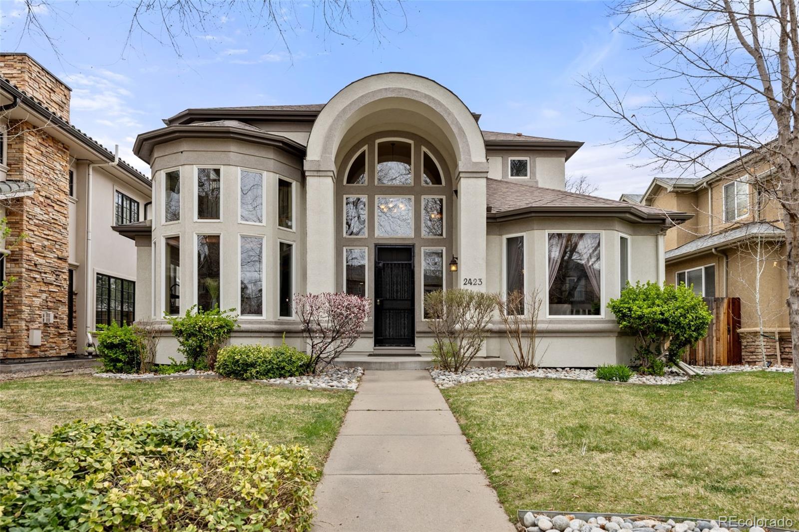 Set in the heart of Observatory Park, this home brings together timeless character and a layout that feels both intentional and easy. Natural light moves through the main level, where the kitchen opens into the living and dining spaces, creating an environment that works just as well for everyday living as it does for hosting. Fresh interior paint gives the home a clean, move-in ready feel while still preserving the warmth and personality that make it stand out.The layout is one of its strongest features. Multiple ensuite bedrooms — including two primary suites — offer a level of privacy and flexibility that’s increasingly hard to find. Whether it’s long-term guests, multigenerational living, or simply wanting space that adapts, the home accommodates it without compromise. A separate heating and cooling system for the second floor adds an additional layer of comfort and efficiency, allowing for individualized climate control.The lower level adds another dimension entirely. A spacious bedroom, open gathering area, and built-in bar create a natural place to unwind or entertain, while the wine room and additional storage bring both function and intention to the space. It’s a level that feels fully integrated into the home rather than secondary.Throughout, details reflect a sense of craftsmanship and care — including custom metal doors that add a distinctive, personal element you don’t often see. Even the practical touches, like a built-in dog door, contribute to how easily the home lives day to day.And then there’s the setting. Observatory Park is one of those neighborhoods that people rarely leave — tree-lined streets, a strong sense of community, and the park itself just a few blocks away. With the University of Denver nearby and easy access to Cherry Creek, downtown, and the Tech Center, the location offers both connection and a sense of calm.