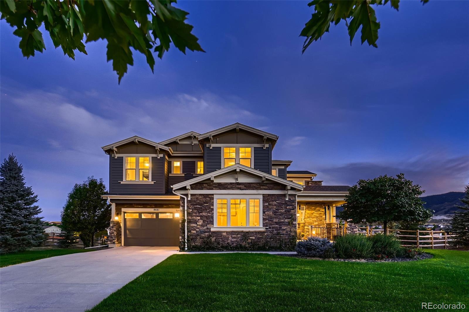 Stunning luxury home on 2.3 acre lot facing expansive mountains views just steps away from the Highline trail connecting to nearby Platt River and lakes.   Step inside to a grand formal entry with cathedral ceilings and grand spiral staircase.  Formal dining faces private side patio with commercial grade sliding doors that open the space up to natural light and more of those Rocky Mountain views.  Open floor plan living greets you as you pass from the formal dining room into the living room, kitchen and casual dining space.  This is the heart of the home with gourmet kitchen with Viking six burner gas range, double oven, quartz counters, convenient kettle faucet along with spacious kitchen island seating.  Kitchen sits adjacent to spacious living room and casual dining nook. All with an array of southern facing windows that bask the area in natural light, foothills views and amazing sunsets.   Just off the living room is a custom-built raised deck with covered seating and dining spaces area with built in outdoor grill.  Might just be the best spot in the house to enjoy the views and back yard.   Next to the kitchen is a flex room that could be a large office or activity / homework space.  Upstairs is a grand primary retreat with private balcony and walk-in closet fit for any size wardrobe.  Primary bath is well-appointed with picturesque standing tub, separate dual vanities and large walk-in shower with dual doors and shower heads.  Three additional guest rooms upstairs with one ensuite bath and one Jack and Jill bath and large upstairs laundry with storage, counter space and sink.  Finished walkout basement with full-sized entertaining kitchen, living room, activity room, guest room and full bath.  Home is professionally landscaped, fenced and includes water fall, stream and Koi Pond.  Owner upgrades include 80K landscaping, 240K covered deck, upgrades to primary bath 40K and EV charger. Must see this one-of-a-kind-home!