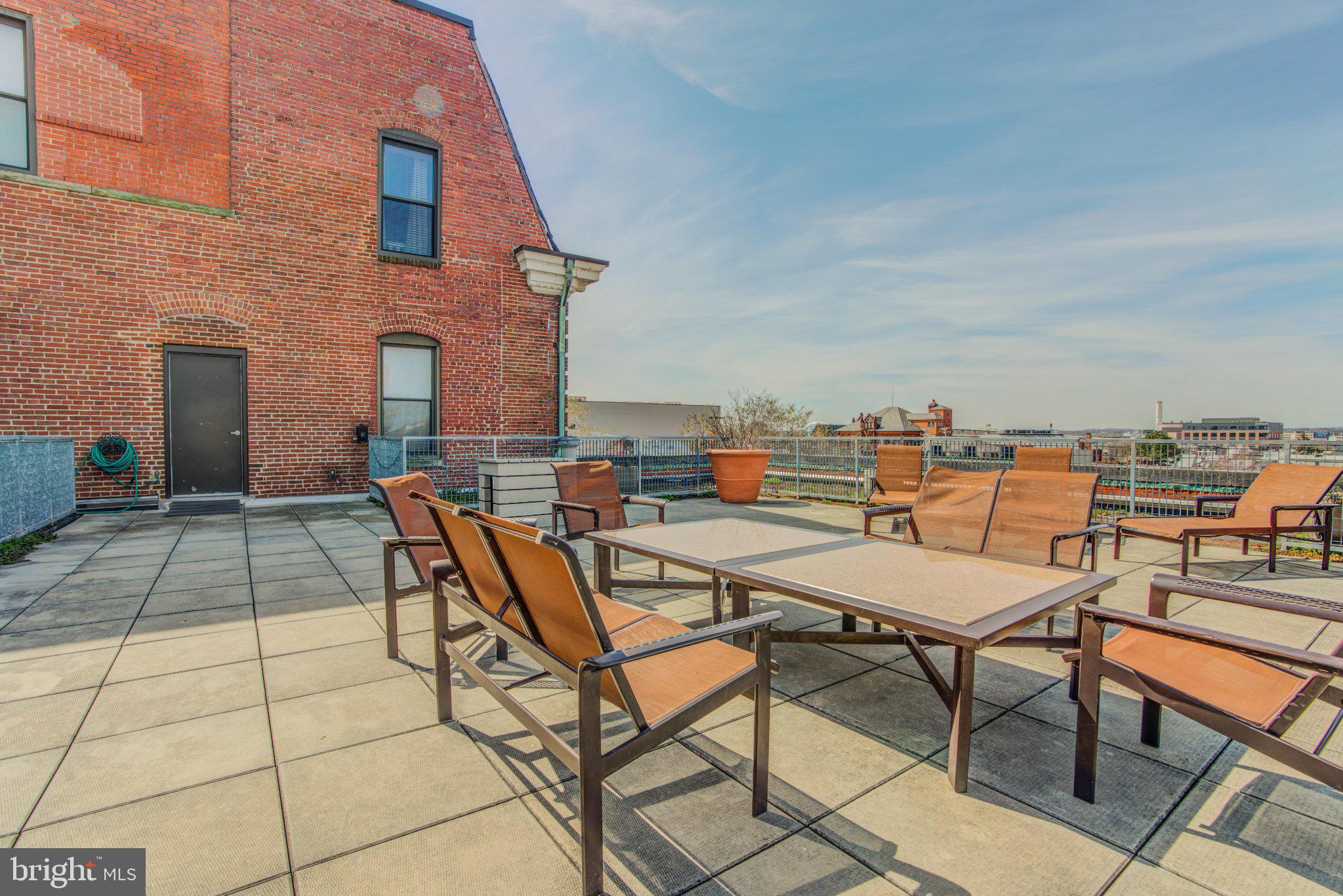 Discover sleek urban living in this 2-bedroom, 2-bathroom condo at 1211 Light Street, Unit 208. With 1,000 square feet of contemporary design, the residence features large, light-filled bedrooms and a spacious living area. The kitchen boasts stainless steel appliances and a breakfast bar, ideal for culinary pursuits.Enjoy a huge rooftop deck, along with amenities like a gym, basketball court, and common media room. Secure garage parking and a secure mail area offer peace of mind, complemented by a modern security system. The low-rise building includes air conditioning and a washer/dryer for added convenience.Nestled in Baltimore's vibrant Federal Hill, this home provides convenient access to an array of dining and entertainment options. Embrace the smart, comfortable lifestyle this residence offers.
