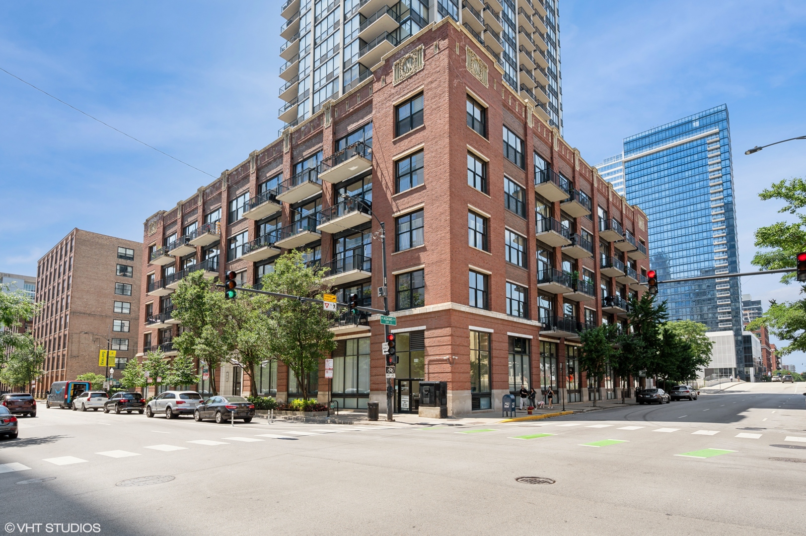 Enjoy over 1,500 sq. ft. of luxurious living space with unobstructed city views framed by oversized windows. This beautifully updated home features a gut renovated modern kitchen with 42" cabinets, sleek stainless steel appliances, newly updated light fixtures, and quartz countertops. The open-concept living and dining area leads to a private balcony, perfect for relaxing or entertaining. The expansive primary suite offers full-height walls, custom his-and-hers walk-in closets, and a spa-inspired marble en suite bath. FULLY enclosed guest bedroom with transom windows and a walk-in closet sits across the hall from the updated guest bath. Building amenities include a doorman, gym, hospitality room, dog run, storage, and bike room. This outstanding West Loop location puts you just steps from Heritage Green Park, Greektown, Whole Foods, Mariano's, and the renowned restaurant row on Randolph and Madison Streets. Convenient access to major expressways (90/94 and I-55), public transit, and the downtown Loop. Rental parking space available.