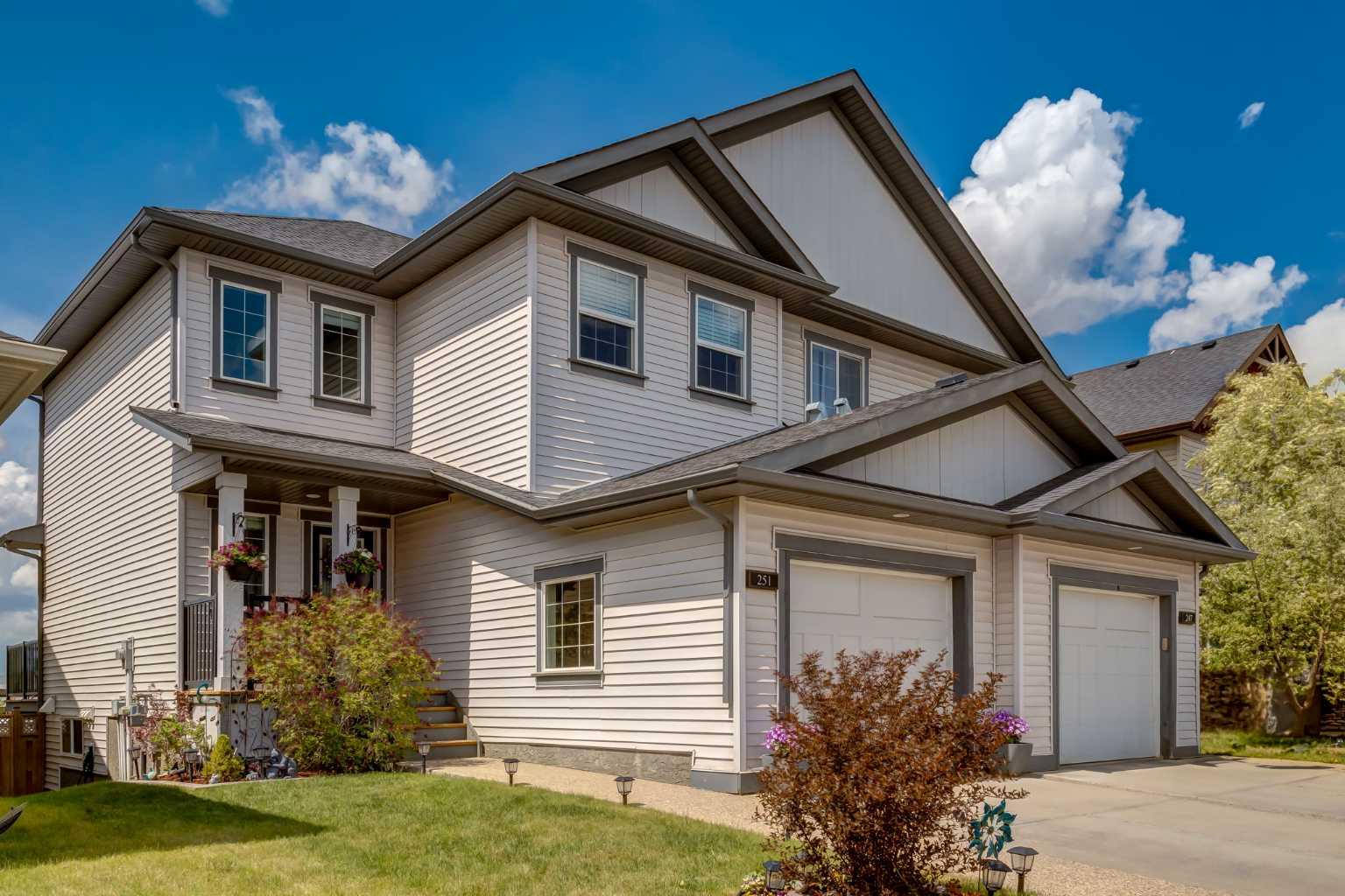 STUNNING FULLY FINISHED WALKOUT BACKING ONTO A GREENBELT IN KING’S HEIGHTS! Welcome to this beautifully maintained and thoughtfully designed two-storey walkout home offering over 1,870 sq ft of living space. Nestled on a quiet street and backing onto a peaceful green space, pride of ownership is evident throughout.  The bright and airy main floor is filled with natural light thanks to large west-facing windows and features an open-concept layout perfect for entertaining. The chef-inspired kitchen boasts upgraded stainless steel appliances—including a gas range with convection oven—tall cabinetry, granite countertops, a central island, and a spacious pantry.  Upstairs, you’ll find TWO large primary suites, each with a walk-in closet and private ensuite—ideal for guests, multi-generational living, or roommates.  The fully developed walk-out basement feels anything but below grade, with 9-ft ceilings and oversized windows. This level offers a generous recreation room, laundry area (with a roughed-in and drywalled bathroom ready for completion), and plenty of storage. A fourth bedroom could be added with just a wall and door. For added convenience, additional laundry hookups are available on the upper level.
  Step outside into your sunny west-facing backyard oasis, fully fenced, landscaped, and incredibly private—perfect for kids, pets, or summer gatherings.  Recent upgrades include fresh interior paint throughout, giving the home a like-new feel. Located just steps from parks, dog parks, walking paths, schools, and shopping, with easy access to both Stoney and Deerfoot Trails—this home truly checks all the boxes. Welcome to King’s Heights—your next chapter starts here!
