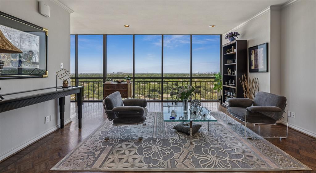 Luxurious Corner Residence with Soaring Views at The Athena.  Experience timeless sophistication in this expansive corner unit at The Athena, one of North Dallas’ most iconic luxury high-rises. This impeccably maintained home is defined by its soaring ceilings, floor-to-ceiling windows, and sweeping panoramic views of the North Dallas skyline. A rare blend of elegance and comfort, the formal and informal living spaces are bathed in natural light—perfect for showcasing fine art or hosting both intimate gatherings and larger-scale entertaining. Rich parquet wood floors flow through the formal living and dining areas, a spacious den, and the guest suite, enhancing the warmth and style of the home.  The kitchen features granite countertops, abundant cabinetry, and a charming breakfast nook—ideal for those who love to cook and entertain. The generously sized primary suite includes custom cabinetry, ample closet space, and a peaceful sitting area to unwind.  As a courtesy to all residents the building is non-smoking, and no pets are allowed.  Please see additional documents for helpful buyer information.  Located in the heart of North Dallas, The Athena offers residents effortless access to Preston Center, NorthPark Center, and top-tier dining and shopping. Exclusive amenities include a year-round indoor pool, state-of-the-art fitness center, and stylish resident lounge.