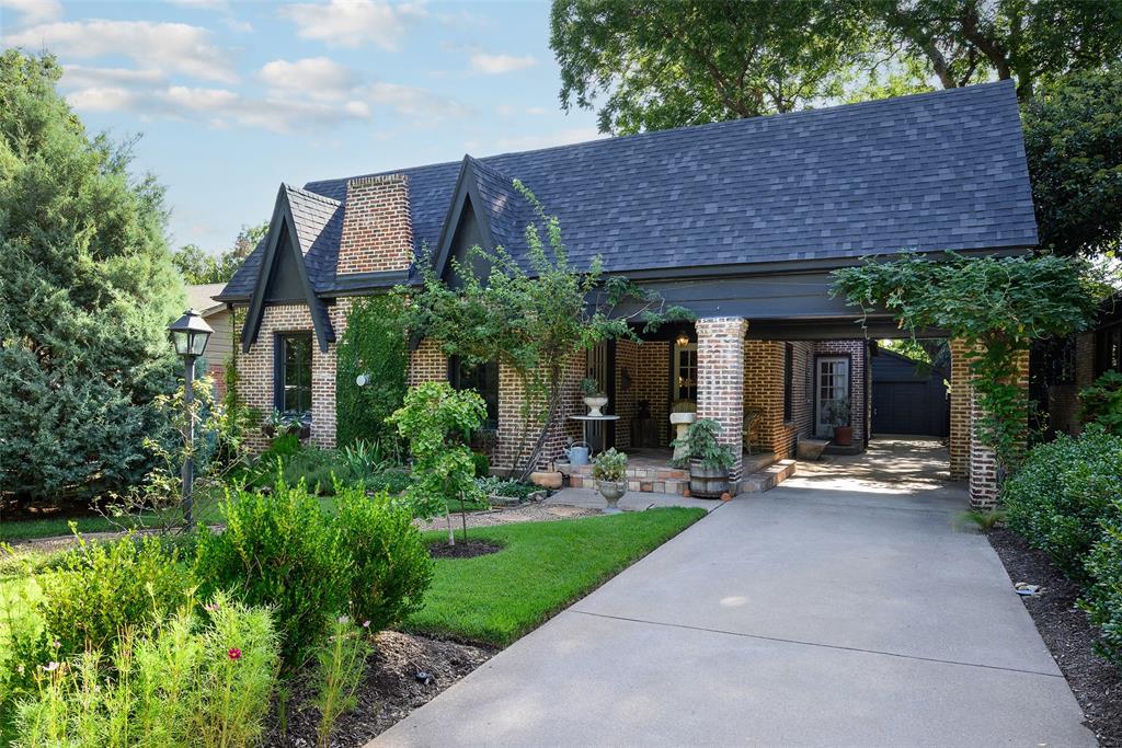 Homes of this caliber, featuring exceptional elegance, meticulous detail, high-quality finishes, and refined design, are rarely available on the market. 1144 N. Windomere exemplifies these qualities. The property is introduced by perennial gardens, which are maintained by the owner. Entry is through the tile-covered front porch, which leads to interiors distinguished by sophisticated design elements. The living room centers on a contemporary fireplace, complemented by custom wall finishes and wood shutters. Imported wallpapers, including Howe Dunn in the kitchen and den and Robert Kline in the breakfast room, enhance the home's character. The kitchen is equipped with a Bertazzoni range, stainless refrigerator, Bosch dishwasher, Carrara marble countertops, and a farm sink, and it overlooks a den with views of the landscaped backyard gardens. The primary suite includes an ensuite bathroom with dual sinks, a bathtub, and a shower. The garage structure contains a studio suitable for a home office, featuring a new mini-split air system and a spacious storage room. Recent improvements encompass the roof, HVAC system, kitchen appliances, and windows. The residence is located within walking distance of Stephens Park Golf Course, Combs Creek Trail, and is near the Bishop Arts District.