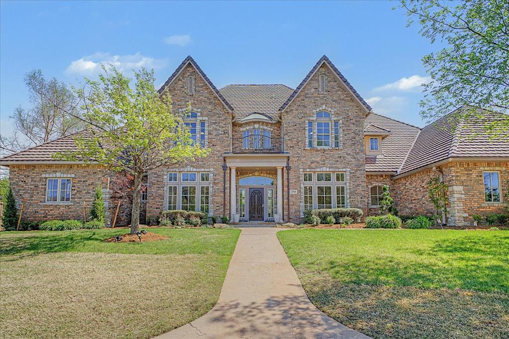 Welcome to this impeccably maintained residence in the prestigious gated community of Gaillardia Golf and Country Club. Upon entry, you are greeted by a versatile formal dining or flex space with natural wood flooring. Soaring ceilings and  floor-to-ceiling windows fill the foyer and formal living area with an abundance of natural light. At the heart of the home the open-concept living, kitchen, and dining areas blend seamlessly. The chef’s kitchen features a stone island, granite countertops, built-in Sub-Zero fridge, double ovens, six-burner gas range with grill top, ice maker, extensive cabinetry, and an oversized walk-in pantry. The family room is anchored by a striking floor-to-ceiling stone fireplace, complemented by custom builtins. The primary suite is a dream featuring a fireplace and private access to the backyard. The ensuite bath offers a jetted tub, dual vanities, and an expansive custom closet complete with a builtin dresser. The closet doubles as a storm shelter/safe room for added peace of mind. The suite also connects to the office, enhanced by a nearby wet bar. The thoughtfully designed floor plan includes a main level guest suite with full bath and walk-in closet. Upstairs, natural wood flooring continues into a spacious loft/game room with a kitchenette and abundant built-in storage. A private third bedroom includes its own ensuite bath, while two additional oversized bedrooms share a well-appointed Jack-and-Jill bath, each with individual vanities and walk-in closets.Outdoors, experience resort-style living with a modern concrete pool, integrated spa, and tranquil waterfall feature—creating a true backyard escape. Recent enhancements include low-maintenance turf in backyard, Nest climate controls, three recently replaced water heaters, updated interior paint, lighting, and fixtures throughout. Offering an exceptional combination of luxury, lifestyle, and value, this residence presents a rare opportunity within Gaillardia. Welcome home.