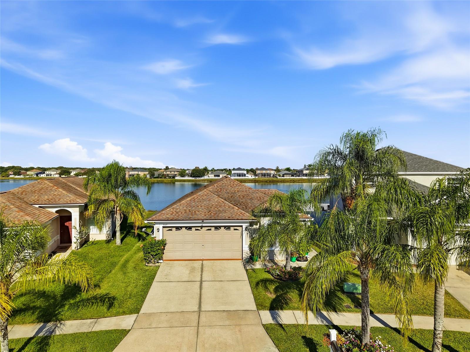 One or more photo(s) has been virtually staged. Welcome to this exceptionally maintained 4-bedroom, 2-bath home—also perfect as a 3-bedroom PLUS OFFICE—with breathtaking LAKE VIEWS that make every day feel like a getaway. From the moment you walk in, you’ll appreciate the abundance of NATURAL LIGHT, gorgeous DECORATOR PAINT COLORS, and the airy, OPEN feel that flows throughout the home. This property is truly move-in ready, featuring NO CARPET, only beautifully installed LVP FLOORING complemented by newer CERAMIC TILE. Major updates bring peace of mind, including a newer roof NEWER ROOF (2020) and AC system (2018). The kitchen shines with GRANITE countertops, stylish finishes, and plenty of workspace, while both bathrooms have been nicely UPDATED for a clean, modern look.Step onto the back patio to experience the real showstopper—the SUNSET SKIES REFLECTING OVER THE LAKE, offering serene views  that feel like a PRIVATE sanctuary. The exterior is just as impressive with lovely landscaping and fresh, tasteful colors inside and out. Located in the heart of Wesley Chapel, you’ll enjoy the convenience of top-rated schools, shopping, medical facilities, and dining just minutes away. With VERY LOW HOA fees and absolutely nothing left to do but move in, this light, bright, spacious home is ready for you to enjoy a peaceful waterfront lifestyle from day one. ***Most furnishings are available for purchase****