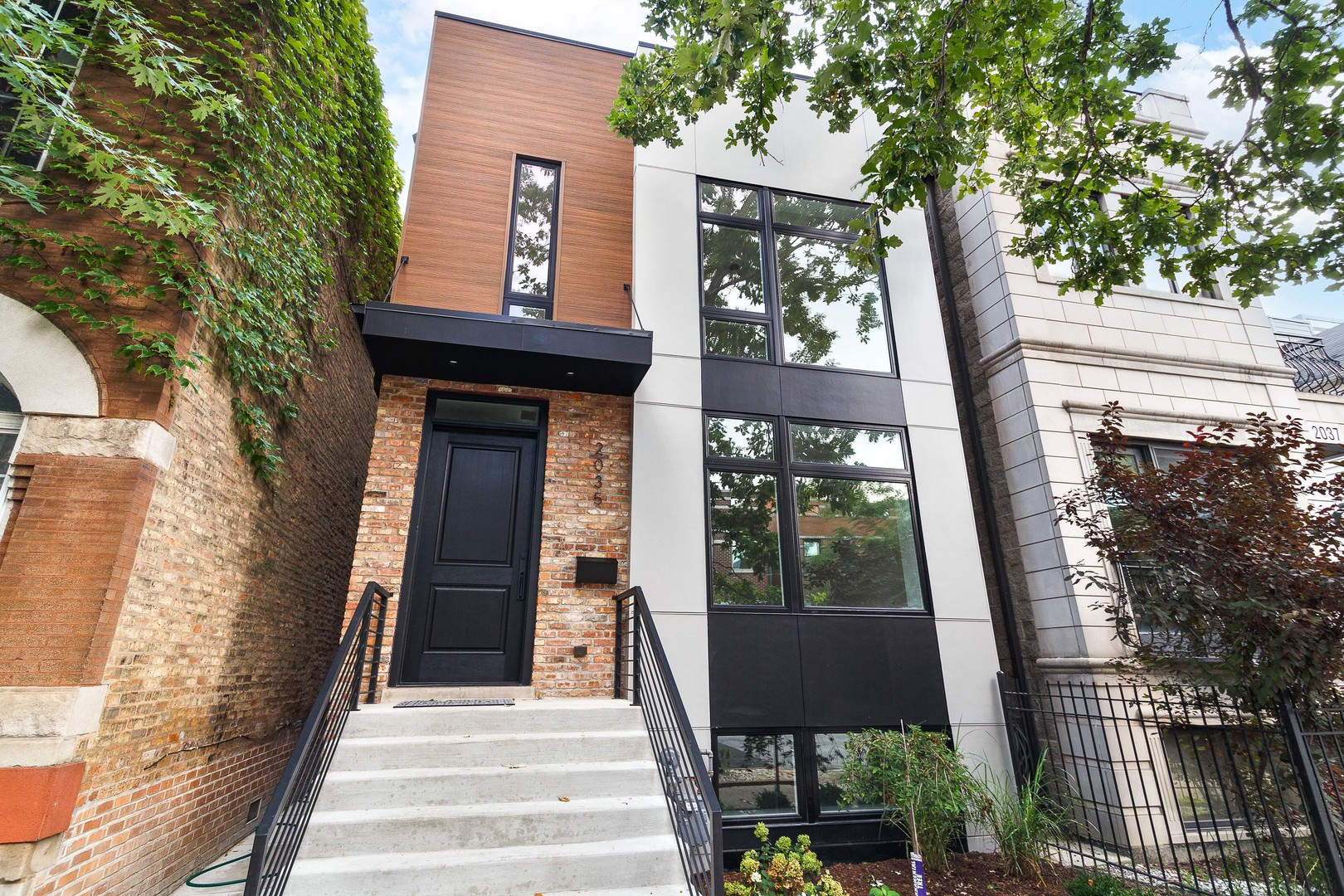 Exceptional ground-up rebuild with tall/deep basement plus rooftop and garage roof deck by premier Chicago builder in West Town! Sharp facade with brick and woodgrain accents and modern front entry. Spacious, sun-drenched floor plan with 4 bedrooms and 3.1 baths. Combined living/dining room features oversized front window. Chef quality kitchen perfect for entertaining equipped with professional grade Wolf/Sub-Zero appliances, large island with waterfall counter and bar seating, custom flat panel cabinetry, and quartz counters and backsplash stretched to the ceiling with modern open shelving. Adjoining family room highlighted by built-in shelving flanking the floor to ceiling fireplace surround. Sliding doors lead to back patio + access to garage roof deck with pergola. Spacious primary suite includes ample closet space with built-in organizers, and spa quality bath featuring a walk-in shower with freestanding soaking tub, dual sinks, and heated flooring. Two additional bedrooms, guest bath with dual sinks and tub, and laundry with Samsung washer/dryer complete the upper-level. Finished lower-level includes recreation room with wet bar + beverage center, 4th bedroom with large WIC, full bath, mechanicals, second laundry hookup, and heated flooring. Every detail has been considered; high end fixtures and finishes, beautiful white oak hardwood flooring, statement lighting, custom ceiling details, built-out closets, and more. Detached two-car garage with roof deck. Prime West Town location close to restaurants, shopping, entertainment, and Smith Park! Easy access to public transportation and other great neighborhoods.