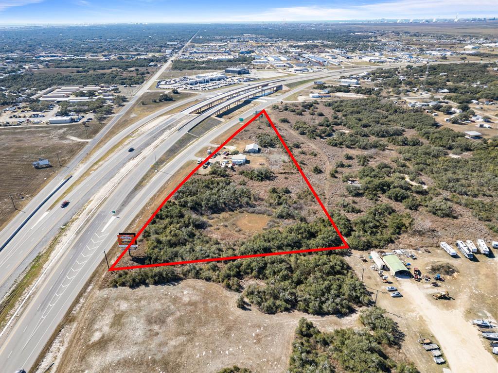 HUGE OPPORTUNITY to own 6 acress off HWY35. Between Rockport & Portland, great place for a business/RV Park with high traffic visibility! Warehouse buildings & office on site. Possibilities are endless.