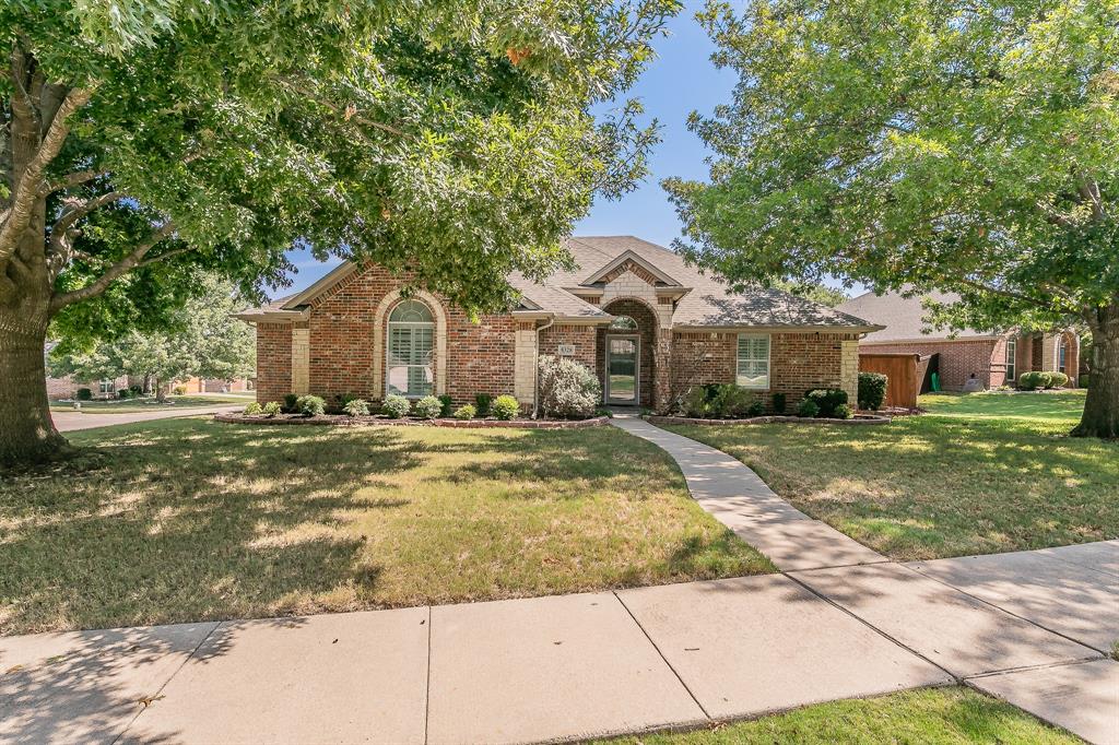 8328 Asta Ct is a 2,375 SF, one-story brick home on a 0.279-acre corner lot in the La Bandera at Team Ranch subdivision in Benbrook, zoned to Fort Worth ISD. Built in 2004 and renovated in 2020, the home sits on a corner lot at Asta Court and La Bandera Trail, shaded by mature trees.Inside, the single-story layout offers four bedrooms and two full bathrooms. The primary suite includes a private bath with a garden tub, a separate glass-enclosed walk-in shower, and a walk-in closet. The living room centers on a stone fireplace beneath a tray ceiling with crown molding, and the kitchen features a quartz-topped island with bar seating, tile backsplash, stainless steel appliances, and a walk-in pantry — open to a breakfast nook and a separate formal dining room. A dedicated laundry room and attached two-car garage round out the floor plan.Outside, the backyard centers on an in-ground pool with an attached hot tub. A covered outdoor kitchen includes a built-in gas grill, bar seating, and a mini fridge. A pergola-covered lounge area with a stone fire pit sits nearby — a full outdoor living setup built for entertaining. The yard is fully fenced, with a storage shed tucked along the back fence line.The location puts you close to Fort Worth's west-side shopping and dining: Clearfork is about 5 miles away (under 12 minutes), Waterside is about 6 miles away (roughly 12 minutes), and downtown Fort Worth is about 11–12 miles away (under 20 minutes).Recent updates include a 2016 composite shingle roof and a 2021 Trane HVAC system.