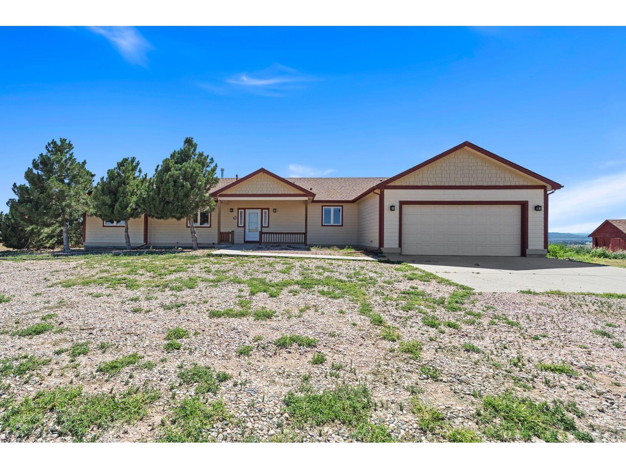 Comfortable country living with incredible mountain views! This custom ranch-style home sits on over 11 acres and borders a Parks and Wildlife sanctuary on the north and west sides, providing added privacy and beautiful natural surroundings. A new well was installed in June 2026, and an Eagle Premier Home Warranty of up to $650 is included. The kitchen features hardwood flooring, Energy Star appliances, granite countertops, a center island, and a pantry. The main level offers a spacious primary suite with a five-piece bathroom, plus two additional bedrooms and a full bathroom. The walkout basement includes another bedroom, a full bathroom, and a large recreation room. A dedicated tornado shelter provides additional protection and peace of mind during severe weather. Additional features include an oversized two-car garage with a service door, two additional quaint rustic outbuildings, a cattle shed, and an impressive 2,560-square-foot heated shop. The shop is equipped with a 15,000-pound truck/car lift, 12-foot overhead doors at both ends, and 320-amp electrical service-ideal for a hobbyist, car enthusiast, or business owner. The property may also offer an opportunity to pursue commercial zoning through Weld County, subject to county review and approval, creating potential for expanded use and additional income. This unique property is a must-see to appreciate everything it has to offer fully! Buyer to verify all measurements and property information. The seller is also offering the adjoining vacant land (2 lots) for sale at $160,000. Please see MLS #1065455 for additional information.