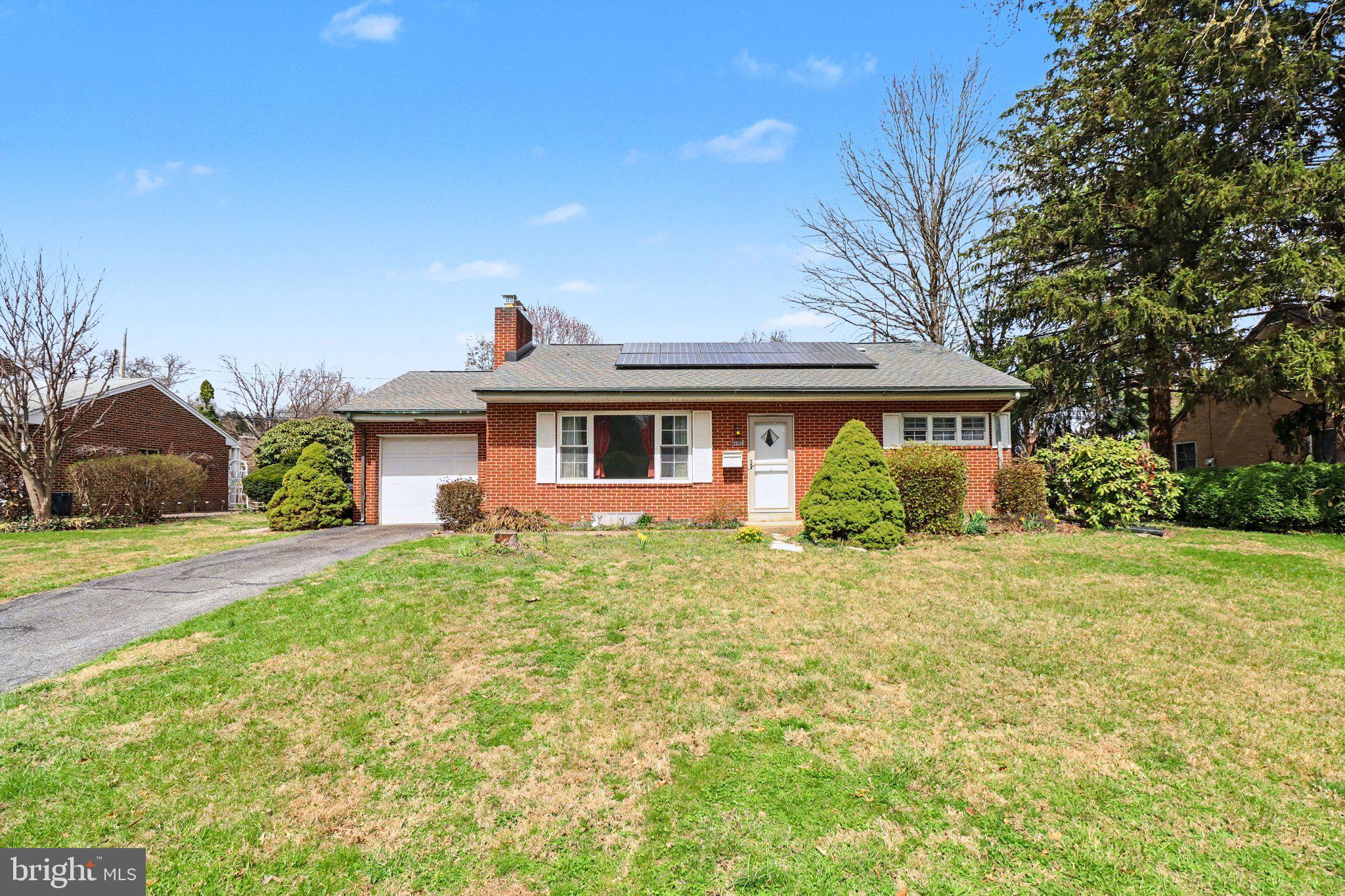 Nestled in the highly desirable Bonnyview community of Susquehanna Township, this charming brick ranch home offers comfort, character, and excellent potential. With approximately 1,141 square feet of living space, this 2-bedroom, 1-bath residence features an attached one-car garage and sits on a level 0.19-acre lot. The thoughtfully designed eat-in kitchen boasts warm wood cabinetry, elegant quartz countertops, and a spacious layout perfect for casual dining. The included range and refrigerator convey, and convenient access to the attached garage makes daily living effortless. Adjacent is a generous dining room with wall-to-wall carpeting, a pass-through to the kitchen, and a large picture window that floods the space with natural light. The inviting living room showcases a striking gas brick fireplace, wall-to-wall carpeting, and another expansive picture window, creating a warm and bright setting for relaxation and entertaining. Both generously sized bedrooms feature beautiful hardwood flooring and ample closet space, while the full bathroom offers a tub/shower combination and is complemented by two hallway linen closets. The expansive unfinished basement provides outstanding storage and workspace, including a laundry room with a freezer, wood cabinetry, and utility tub, along with a large workshop area and a convenient walk-in cedar closet. Additional highlights include owned solar panels, newer windows, a newer tub surround, and a screened-in rear porch. This well-built home is situated in a sought-after neighborhood within the Susquehanna Township School District and is ready for your personal updates and vision. With a little TLC and some thoughtful improvements, this property offers tremendous opportunity to create an ideal home. Call today to schedule your private tour.