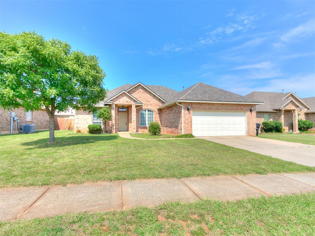 Welcome to this inviting three-bedroom, two-bath home in the desirable Gabriel’s Crossing addition of Moore, Oklahoma. Built in 2006 and offering 1,548 square feet of single-level living space, this home features a timeless red brick facade with a welcoming covered entry and sits on a spacious corner lot.

Inside, the open-concept living room is filled with natural light and highlighted by vaulted ceilings, recessed lighting, and a cozy fireplace that creates a warm and comfortable atmosphere. The kitchen provides ample cabinet space, tile flooring, stainless steel appliances, and a breakfast area that opens into the main living space, while a formal dining area near the entry adds flexibility for entertaining.

The primary suite is a true retreat with a tray ceiling, generous layout, and a private bath featuring a double vanity, a soaking tub, a separate shower, and a walk-in closet. Two additional bedrooms and a full bath provide comfortable accommodations for family or guests.

Outdoors, a back patio overlooks the large fenced yard, offering plenty of space for pets, play, or gardening. The attached two-car garage with an in-ground storm shelter adds both convenience and peace of mind. With neutral paint throughout, ceiling fans in the main rooms, central heating and air, and a durable composition roof, this home combines comfort, practicality, and long-term value.

Situated within the Moore School District and offering easy access to shopping, dining, and I-35, this home presents an excellent opportunity to own a well-maintained property in one of Moore’s established neighborhoods.