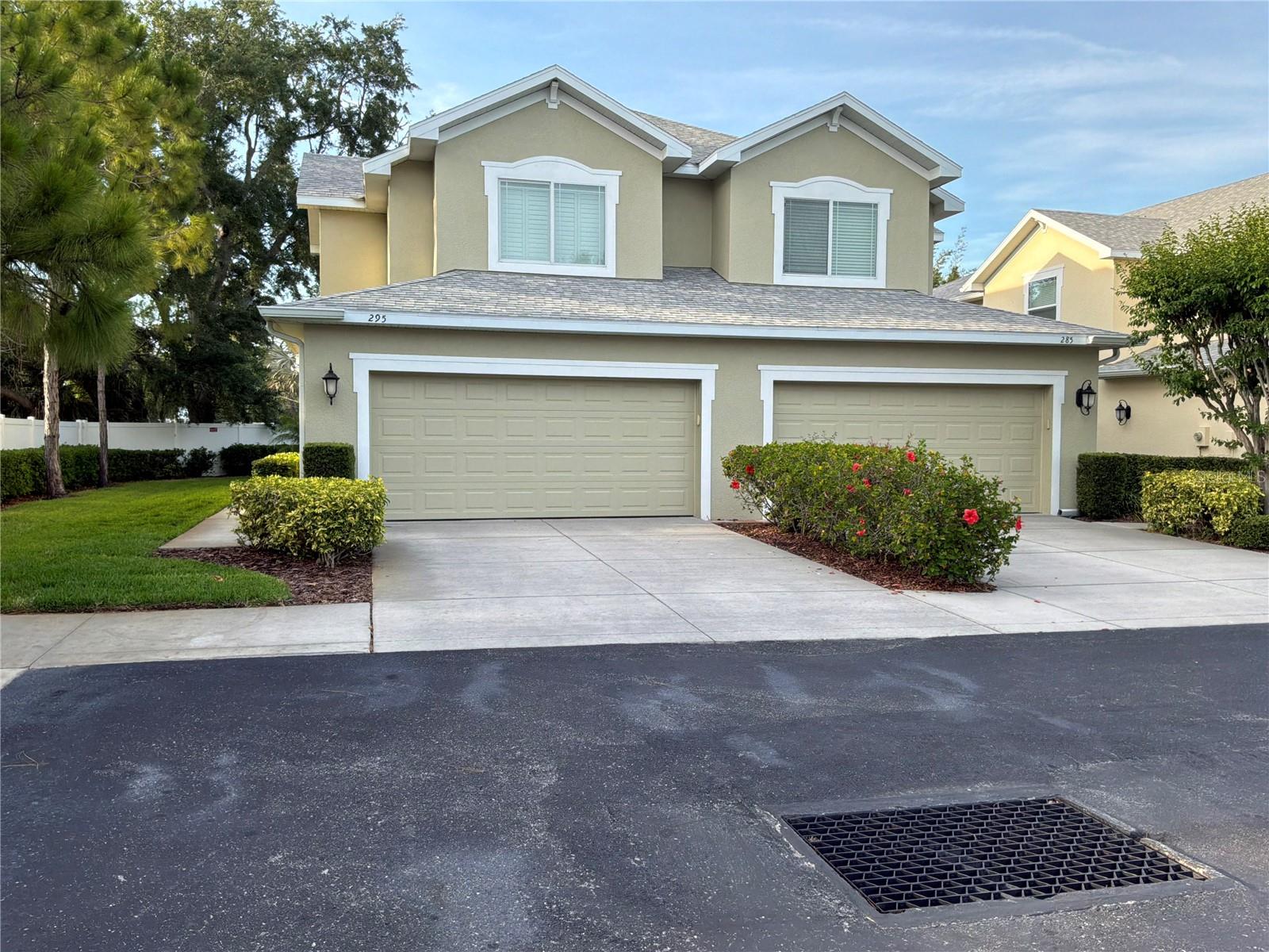 Enjoy maintenance free living in the beautiful community of Harbor Ridge. This is a MUST SEE true end unit with lots of privacy. It has the feel of your own private home oasis with a side yard and back patio. Entering the home the room opens to a spacious floor plan with 10 ft. ceilings making it open and airy. The home has plantation shutters throughout including the 12-foot wall of triple sliding doors which pocket back creating an extra wide opening for a view and access to the screened lanai and patio. The home features many upgrades, including hardwood floors, quartz countertops, and a walk-in pantry. The eat-in kitchen features newer stainless steel appliances, new large one bowl sink and new stylish black faucet. The first floor also offers a half-bath powder room. The second floor features an oversized master bedroom with private bath, dual vanities and a large walk-in closet. There are two additional large bedrooms on the second floor with spacious closets and private bath. The laundry is conveniently located on the second floor. The spacious two car garage has two extra-large storage racks with plenty of room to hold all your beach chairs and other necessities for your outdoor activities. With a new HVAC system installed in March 2026 you will have piece of mind for the summer months ahead.Harbor Ridge offers low maintenance fees of $420 per month. Fees include landscaping, roof maintenance and replacement, water, sewer, high speed internet and premium cable, exterior painting, trash, recycling and a community pool with a cabana. No flood insurance is required. This quiet community is conveniently located to shopping, restaurants, parks, beaches and the Pinellas Trail. You can hop on the Jolly Trolly next to the main entrance and ride south to Clearwater or north to the Sponge Docks. Don’t miss this one!
