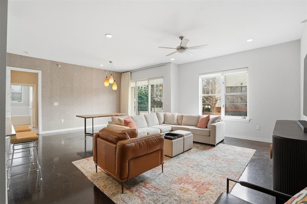 FURNISHED RENTAL! This nearly 1,200 SF urban oasis is truly remarkable. From the moment you enter, the dark concrete floors and contemporary paint palette, complemented by custom wall coverings, create a chic, artsy atmosphere. The spacious living room flows seamlessly into a modern kitchen, complete with sleek cabinetry and abundant counter space. Just off the dining area, a generous covered balcony offers the perfect spot for outdoor furniture and relaxing in style. The oversized primary suite is a dream, featuring custom wall coverings, ample room for a king-size bed, chic carpeting, and a beautiful chest of drawers. And the closet—unusually large for a one-bedroom—boasts abundant storage space. A smaller private balcony extends from the primary suite, adding a serene outdoor retreat. Step outside and find yourself mere steps from W. 7th’s vibrant shops, restaurants, and Trinity Park, which offers over 70 miles of trails for biking and running enthusiasts. The property also features a convenient back gate for easy access to nearby grocery stores, dining, and shopping options. Residence #3202 includes one reserved and one non-reserved parking space. The Art House features a community pool and dog park. All applicants will have a thorough background check.
