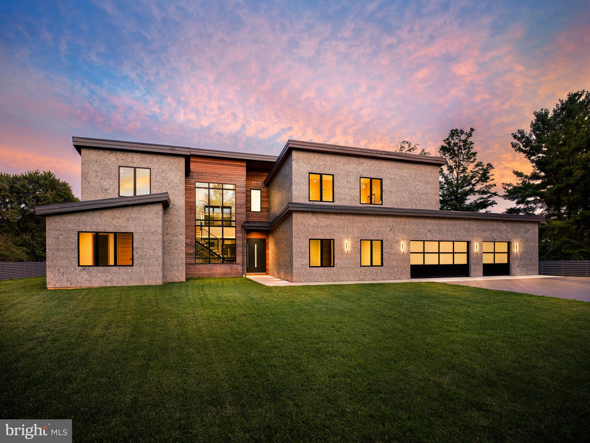 Contemporary architecture, globally sourced materials, advanced engineering, and seamlessly integrated smart-home technology define 298 Paoli Pike—a newly constructed residence bringing a distinctly modern vision of luxury living to the Main Line.Set on a level, fenced acre in Willistown Township, the home offers approximately 4,713 square feet, five bedrooms, four full and one half baths, and an exceptionally flexible floor plan. Designed as four interconnected architectural pavilions rather than one continuous structure, the layout creates distinct zones for private living, entertaining, work, wellness, guests, or multigenerational living while maintaining a cohesive flow.The home includes five designated bedrooms, four with en-suite baths, plus dedicated office, entertainment, and gym spaces. Select flex areas may be reconfigured to accommodate up to seven bedrooms, subject to municipal approval, making the home adaptable to changing lifestyles.The exterior showcases a ventilated façade clad in large-format Dekton from Cosentino’s Pietra Kode collection, paired with natural Brazilian teak, black-framed windows, minimalist railings, and a standing-seam metal roof. The result is a sophisticated, durable exterior inspired by contemporary European design.A broad motor court finished in Italian porcelain leads to oversized contemporary garage doors, while horizontal metal fencing and expansive lawn provide privacy without sacrificing openness.Inside, a dramatic two-story glass stair tower features a custom open-riser staircase of light wood, black steel, and glass, filling the home’s center with natural light.The double-height great room is highlighted by soaring ceilings, clerestory windows, an upper-level bridge, a wood ceiling, and a linear fireplace set within dramatic large-format Dekton. A multi-panel sliding glass wall opens nearly the entire living space to a protected rear courtyard with Brazilian teak soffits, creating seamless indoor-outdoor living.The minimalist European-inspired kitchen features full-height wood cabinetry, integrated stainless-steel appliances, concealed storage, a waterfall-edge island, and a large picture window overlooking the property.Large-format flooring extends throughout the first floor with radiant heat beneath. Upstairs, premium Frevini flooring, custom San Rafael doors, and Italian hardware continue the home’s refined aesthetic.DMF architectural lighting and Josh.ai smart-home technology integrate lighting, entertainment, security, motorized shades, and personalized scenes into one intuitive system.Engineered for comfort and efficiency, the home features spray-foam insulation, four zoned HVAC systems, and integrated UV air treatment.A rare Digital Passport documents the home’s framing, plumbing, electrical, and mechanical systems through 3D imaging captured during construction, providing future owners with exceptional transparency for maintenance or renovations.The heated, air-conditioned, approximately 861-square-foot garage offers flexibility for vehicle storage, a workshop, fitness studio, recreation space, or year-round storage.Conveniently located minutes from Malvern Borough, Paoli Station, and the Route 202 corridor, 298 Paoli Pike offers a rare opportunity to own a truly contemporary home designed from the ground up as a unified architectural, engineering, and smart-home system.