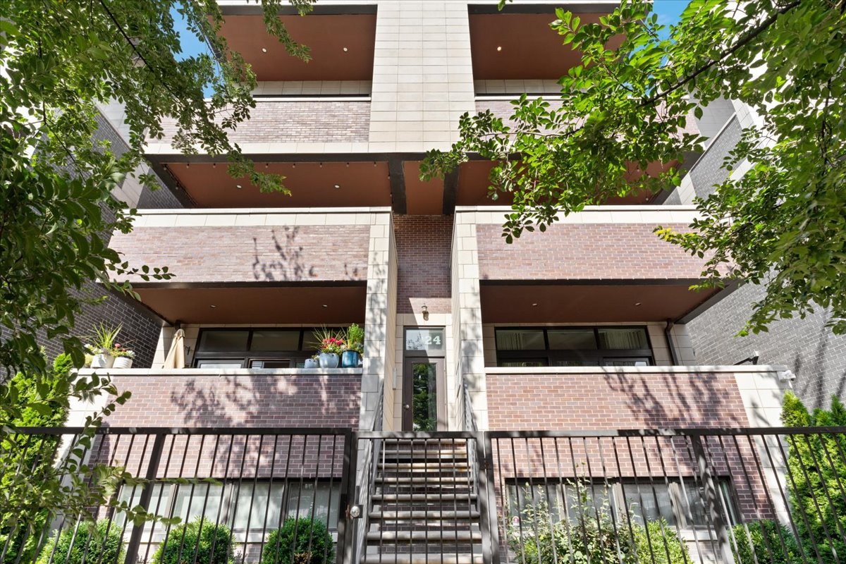 Experience modern city living in this stunning 2 bedroom, 2 bathroom condo located in the heart of Chicago's vibrant West Town neighborhood. Designed with an open and airy layout, this home features a spacious living area, sleek chef's kitchen with premium stainless steel appliances, and a serene primary suite with a spa-inspired bathroom.  The crown jewel of this residence is the private rooftop oasis, perfectly built out with a full outdoor kitchen, gas fireplace and tons of seating room ideal for entertaining or enjoying Chicago's skyline views year-round. Whether hosting summer gatherings, dining al fresco, or simply relaxing in your own private retreat, this rooftop space elevates your lifestyle above the rest.