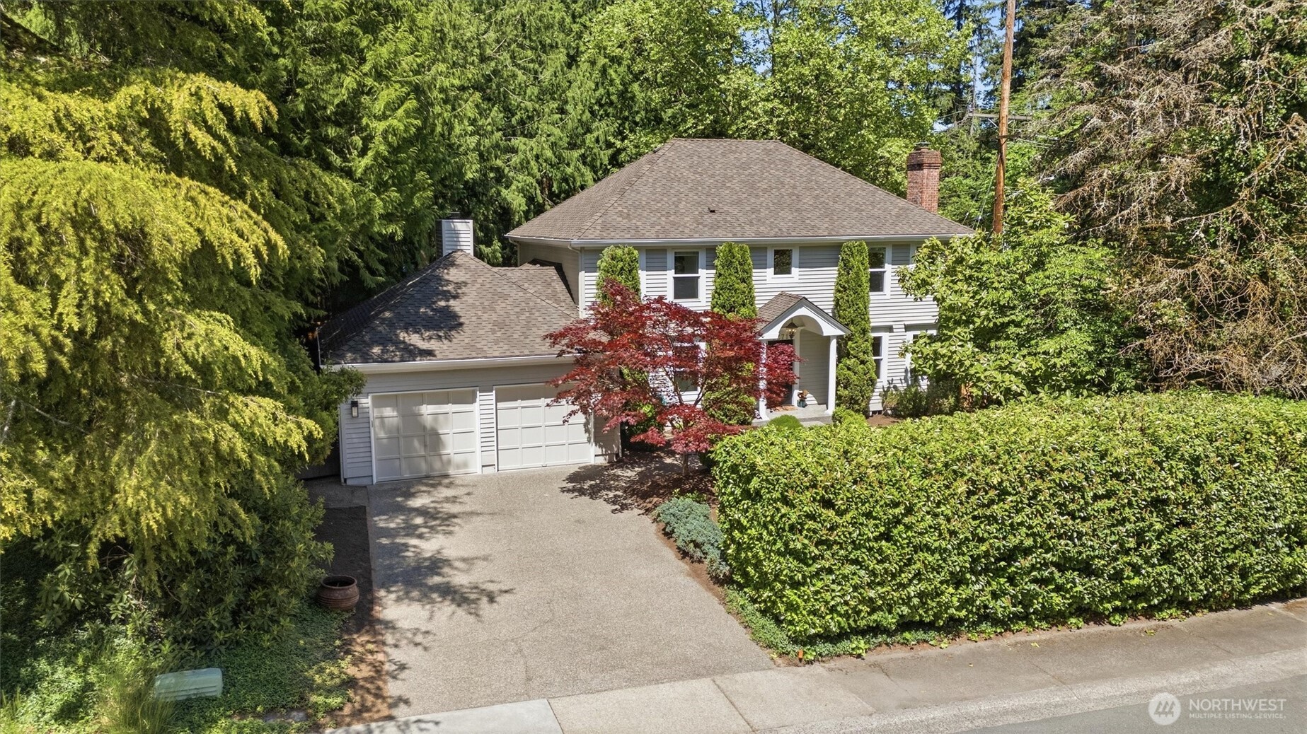 Welcome to Heritage Hills, one of Sammamish’s most beloved communities, ideally located near Sahalee and known for its scenic surroundings, top-rated Lake Washington schools, and exceptional neighborhood amenities. Enjoy a lifestyle surrounded by walking trails, lush parks, tennis and basketball courts, a heated community pool, and easy access to shopping, dining, Redmond, Issaquah, and SR-520. This timeless colonial style home radiates elegance and charm with statement columns to welcome your guests, a grand two-story foyer for a stunning first impression, rich millwork, crown molding, wainscoting, fresh interior and exterior paint, and brand-new carpet. The functional floor plan offers a formal living with fireplace, formal dining room, and a versatile den/4th bedroom with built-ins and a closet. The chef’s kitchen featuring slab granite counters, stainless steel appliances, hardwood flooring, double pantry, and sunny breakfast nook opens to the spacious family room with fireplace. Retreat to the luxurious primary suite with walk-in closet and spa-inspired 5-piece bath showcasing Carrera marble and jetted tub. Enjoy the large private yard and entertainment-sized deck, perfect for gatherings and outdoor living. Oversized 2-car garage with extra parking and a new roof in 2018 complete this move-in ready home in a sought-after neighborhood known for community, convenience, and natural beauty.