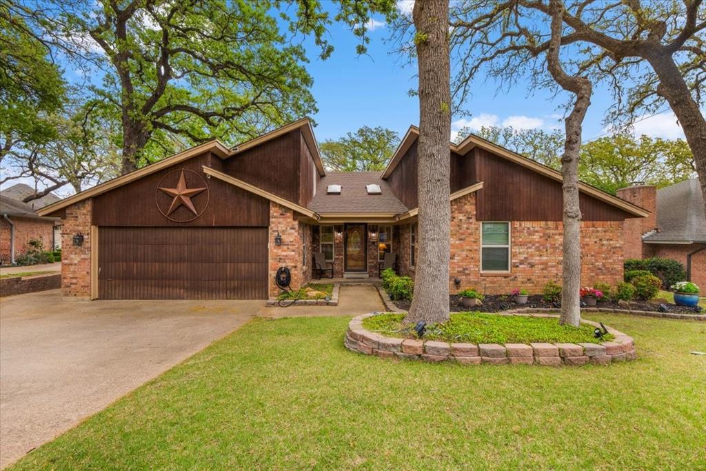 Welcome to this beautifully maintained home nestled on a quiet cul-de-sac in the heart of Grapevine! Surrounded by mature trees and set on a peaceful street, this property offers both privacy and a true neighborhood feel. Step inside to discover a spacious living area anchored by a stunning double-sided statement brick fireplace—creating a warm, inviting focal point that connects multiple living spaces. Vaulted ceilings with exposed beams and abundant natural light enhance the openness, while a versatile bonus room just off the main living area provides the perfect space for a home office, playroom, or additional lounge. The kitchen is both practical and welcoming, featuring stainless steel appliances, a center island ideal for gathering, and a generous pantry for ample storage. The primary suite offers a private retreat with an en-suite bathroom, while the secondary bathroom stands out with an impressive amount of storage—perfect for keeping everything organized. Step outside to your covered patio, complete with a built-in grill, creating the ultimate setting for entertaining year-round. The backyard also includes a storage shed and plenty of space to relax, garden, or play. Located in sought-after Grapevine with convenient access to shopping, dining, and major highways, this home combines comfort, character, and location in one exceptional opportunity. Schedule your showing today!
