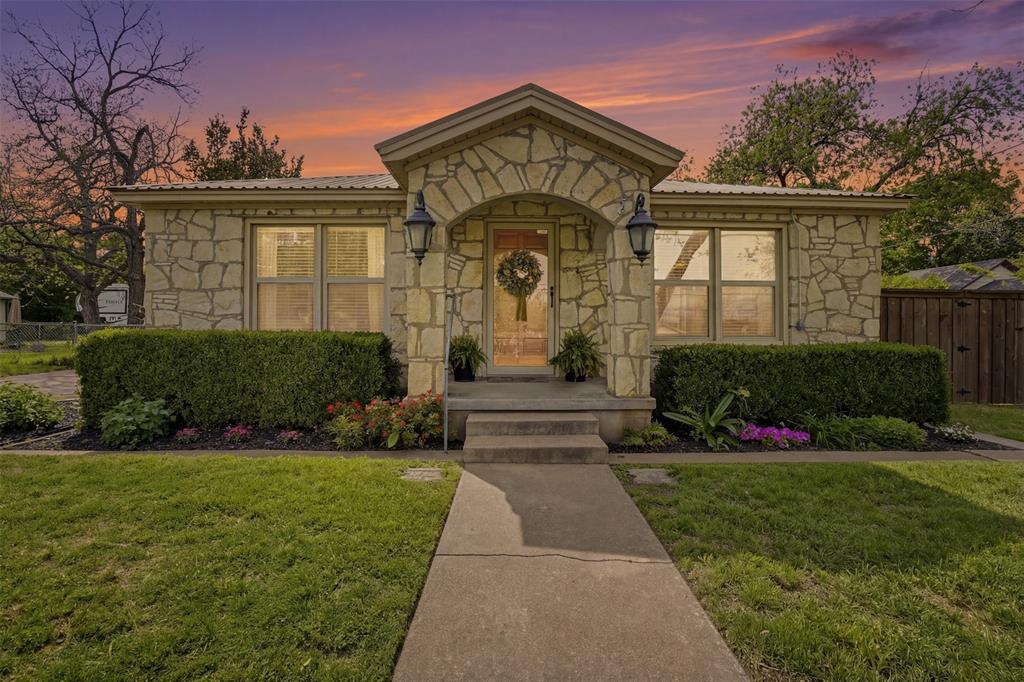 Set in the heart of Granbury, this thoughtfully maintained 2 bedroom, 2 bathroom home blends timeless character with meaningful updates and an unbeatable location just moments from the historic square.Originally built in 1935, the home showcases original hardwood floors, abundant natural light, and oversized bedrooms. The kitchen has been updated with newer appliances, countertops, and a farmhouse sink with a brass bridge faucet, creating a warm and functional space that complements the home’s charm.Recent improvements include a new HVAC system installed July 2025, metal roof, and upgraded fencing with double gate access. The property sits on an oversized lot with a large backyard, mature trees, and space for outdoor enjoyment. A stone patio, fire pit area, and string lighting create an inviting setting for gatherings or quiet evenings at home.The detached garage, approximately 50 x 14, with electricity includes an extended workshop-style addition at the rear, creating a long, functional layout with flexibility for storage, projects, or hobbies today, and the opportunity to reimagine the space over time to fit your needs.Located across from the library and just moments from Granbury’s historic square, local parks, and walking trails, this home places you close to year-round community events, dining, shopping, and entertainment.