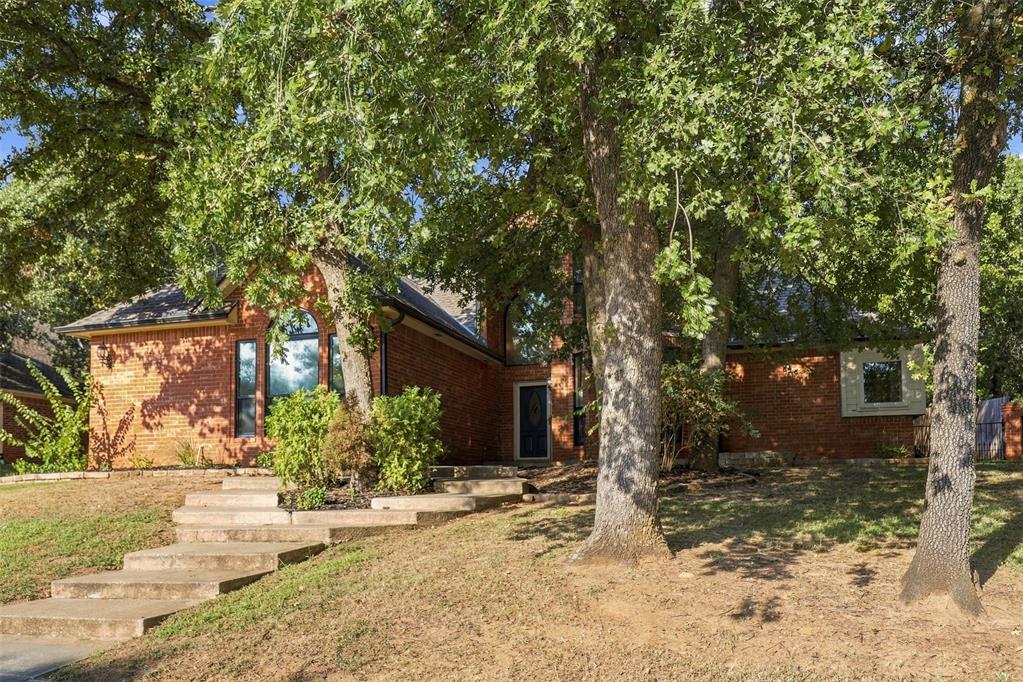 This 4 bed 2.5 Bath home plus office is located in the highly sought-after Bradbury Corner Addition and in the Edmond School District!  The living space is perfect for entertaining family, friends, and guests you may have. Large windows provide an abundant natural light with a beautiful view of the wooded backyard from the formal living room and a second living area that features a double-sided fireplace.  The kitchen is a chef's dream, offering a large center island, pantry, endless cabinet and counter space, with an open breakfast area with a bay window and seat.  Covered back patio with a pergola, tiered backyard, and newer fences go hand in hand for entertaining!  The primary suite is the perfect retreat to read a book, relax, or enjoy some quite time.  The spa-like bathroom has a large walk-in shower with bathtub, double vanities, and two walk-in closets.    Upstairs, you'll find three additional bedrooms all with walk-in closets, ceiling fans, a beautifully updated Jack and Jill bathroom with dual sinks, and large storage cabinets in the hallway. Two attic spaces with walk-in access make storage a breeze. Extensive recent improvements including new Pella windows, a 2022 roof, new HVAC both up and downstairs, new hot water tank, new fence, updated bathrooms, new light fixtures and fans, new downstairs blinds, new wood floors in the entry and office, and new carpet throughout the entire home. Additional features include an in-ground storm shelter in the garage!  This move-in ready home offers the perfect blend of comfort, style, and functionality in one of Edmond's most desirable neighborhoods great for a daily exercise, local playground and walking distance of the new Uncommon Grounds Sculpture Park.