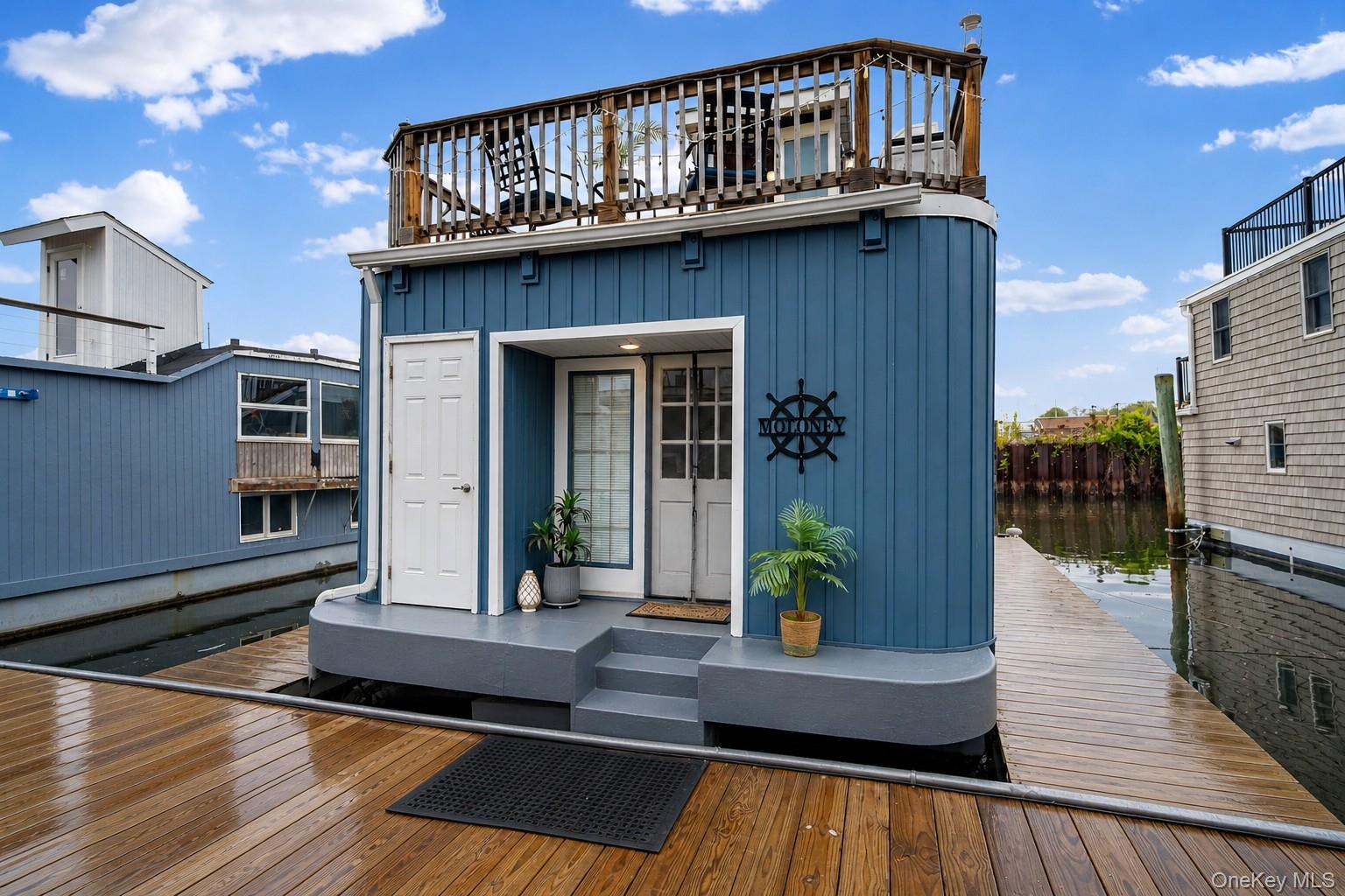 Start living your waterfront lifestyle today! This floating houseboat offers the perfect blend of comfort, charm, and adventure. Featuring 2 bedrooms and 1 bathroom with ample closet space, the open floor plan is ideal for both everyday living and entertaining. Enjoy multiple outdoor living spaces, including a balcony off the kitchen, a spacious lower deck, and an upper deck with breathtaking 360-degree panoramic view of Manhasset Bay. The pressure-treated wood decking adds durability and a unique coastal character. Comfort is ensured with three split A/C and heating units, propane cooking, and a newer water heater. The home is powered by shore power for convenience. Located in a prime waterfront setting, just moment from Bat Walk Park, Scenic waterfront paths, marinas , and the vibrant shopping, dining, and amenities of Part Washington's town center. This rare waterfront opportunity is available for cash purchase only. Monthly docking fee is $1,500.Experience the joy of waterfront living without the high cost of a traditional home - make it yours today!