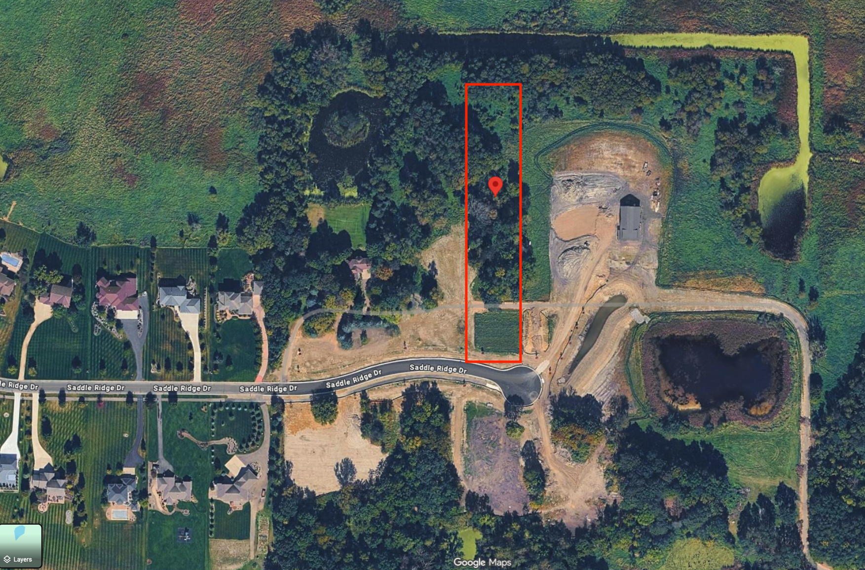 Stunning 2.5-acre parcel ready for your dream home! This large 2.5-acre parcel is situated in a beautiful executive neighborhood and is ready for your design. Development is approved for an additionaldetached garage. The heavy tree coverage on the back half of the lot provides ideal privacy. Location is fantastic in the heart of Rogers, just minutes from all the amenities you could want or need. Don't miss out on this rare opportunity!