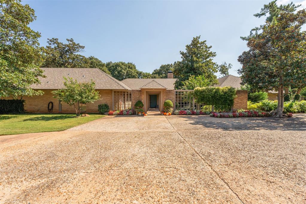 This stunning 4,500 sq/ft residence nestled inside an exclusive gated enclave boasts three bedrooms, three full bathrooms, a half bath, one study, a spacious gallery hall, and one Florida room that could also double as a convenient workout space.  The gated community provides additional privacy, security and prestige on a spacious, well-treed, rare lot inside the city. Expertly crafted for comfort, elegance, and effortless entertaining, the home offers an open layout, sophisticated fixtures, and luxury finishes throughout. Inside, the high ceilings and stunning floor-to-ceiling windows visually expand the space, delivering a dramatic, open-feel environment. The chef’s-grade kitchen outfitted with premium finishes and top-tier appliances makes hosting easy and elegant.
Designed with entertaining in mind, this home flows beautifully from indoor to outdoor. An oversized yard and huge back porch ideal for outdoor gatherings provides the perfect atmosphere for casual relaxation or al fresco dining while the spacious circle driveway offers ample guest parking. The expansive backyard overlooks a partial greenbelt perfect for large summer cook-outs, kids at play, or quiet evenings under the stars. 
Located in one of Northwest Oklahoma City’s coveted corridors, this home offers both tranquility and convenience. You’ll enjoy quick access to major retail, dining and everyday conveniences, plus easy access to the Turnpike, making commutes and weekend getaways seamless and giving a feeling of country living within city limits. The blend of upscale community living and an accessible location makes this property a rare find.
Whether you’re enjoying a quiet morning coffee on the porch or hosting friends for dinner, this home accommodates every facet of elevated living. The gated setting offers pleasant lower neighborhood traffic, the architectural elegance commands attention, and the functional features deliver comfort for everyday life.