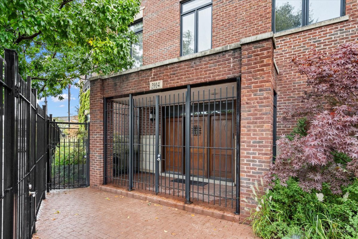 This extraordinary custom-built estate redefines luxury living in Chicago's West Elsdon neighborhood, offering over 5,760 square feet of living space in a privately gated residence constructed in 2005 with a full masonry and stone exterior, high-end mechanical systems, and exceptional custom craftsmanship. The home features 5 spacious bedrooms and 3 bathrooms plus 2 powder rooms, including 3 bedroom suites with private bathrooms, custom shelving in every closet, and a built-in elevator serving all levels. Radiant heated floors warm the first level, while the second-level living room includes a gas fireplace and a stunning Rich Toffee custom library wall with rolling ladder; the expansive chef's kitchen is equipped with Sub-Zero side-by-side oversized refrigeration, double ovens, two dishwashers, and a built-in trash compactor, and a private second-floor garden with outdoor fireplace and perennial landscaping provides a peaceful sanctuary. The third-level primary suite offers a private balcony, built-in cabinetry, and a spa-inspired bathroom with standalone shower and deep Jacuzzi soaking tub, complemented by an expansive rooftop deck with breathtaking 360-degree skyline views. A 3-car heated garage plus additional outdoor parking sits within the gated grounds. Located just 15 minutes from Downtown Chicago with convenient access to I-55, I-90/94, I-294, the Pulaski Orange Line, and Midway International Airport, this rare property combines size, privacy, and luxury amenities-schedule your private tour today!