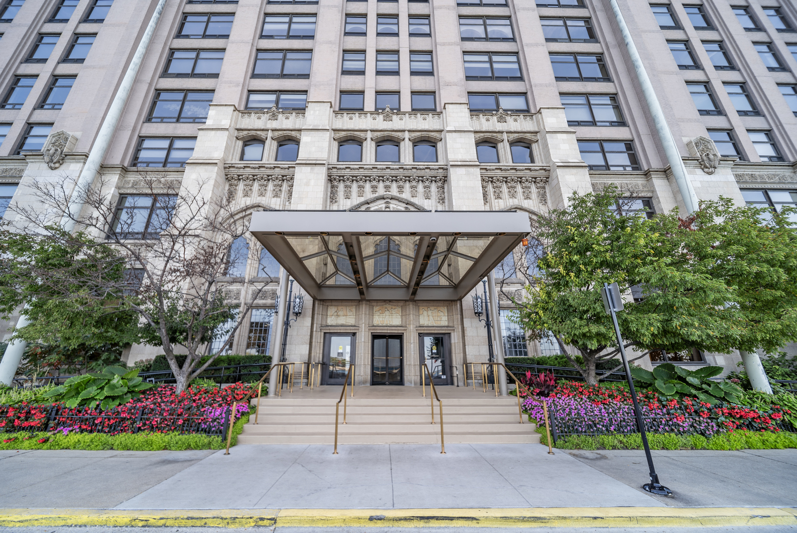 Welcome to an exquisitely reimagined residence at 680 North Lake Shore Drive, Unit 604, Chicago, IL. This stunning high-rise condo invites you into a modern space designed for both comfortable family living and large-scale entertaining. The newly crafted open concept floor plan offers 3 spacious bedrooms and 2.5 luxurious bathrooms within its expansive 2,900 square feet.  This light-filled home boasts soaring over 9-foot ceilings (raised during rehab) and an expansive east-facing living room, complemented by a built-in bar, dedicated dining room, and a large open concept kitchen. The well-designed floor plan flows seamlessly, featuring brand new wide plank hardwood flooring throughout and extraordinary storage solutions. Be captivated by unobstructed views of Navy Pier through arched windows, highlighted with sophisticated LED lighting and electric/remote solar blinds for added convenience.  The chef's kitchen is a masterpiece, equipped with brand-new stainless-steel appliances, including a 36" Thor electric stove with an external venting hood and a 36" Samsung 4-Door Refrigerator. Exquisite Taj Quartz countertops, a full backsplash, and an 8-foot extra wide waterfall island with an integrated round table ensure a perfect setting for an eat-in kitchen with a view. A separate walk-in pantry with custom shelving and a separate bar area with a wine refrigerator are perfect for entertaining guests.  The primary suite offers designer details with fluted paneled wood walls and a walk-in closet featuring custom built-out storage with contemporary barn doors. The ensuite spa-like bathroom includes a double vanity, a freestanding soaking tub, and a separate shower, all accented with LED lighting.  Convenience is key with a brand-new side-by-side washer and dryer in a generous laundry room. Building amenities enhance living with 24-hour doorman service, a fitness center, indoor pool, bicycle storage, dry cleaners, and indoor parking. Located in one of Chicago's most iconic historic buildings, you are within walking distance to the Museum of Contemporary Art, dining, shopping, Northwestern Medical, and everything a world-class city like Chicago has to offer. Additional storage space.  One prime parking spot is available for an additional $60k, conveniently located on the same floor as the residence for easy access. Experience luxury living with lakefront views, central AC, and modern elegance in every detail.