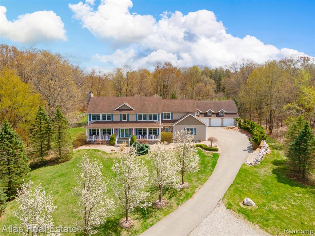 THIS ESTATE HOME WILL AMAZE YOU!!! Beautifull quality filled 4 Large Bedrooms 4+Bath in a quiet peaceful 12+acre Country setting. As you walk into this warm inviting home you will fall in love. Large gourmet kitchen with beautiful cabinetry, hardwood flooring, and a fire lit Living room. First floor has your laundry room, living room, dining room, and an office for you to work from home. The second floor includes your 4 bedrooms and 2 baths. Primary bedroom has a gigantic walk-in closet and fireplace. As you enter the basement you will love the Theater Room with surround sound and the Rec Room with a Bar and lots of room for entertaining. Home has ALL the Extras. Central Vacuum system, security alarm, whole house generator, wood burner in the basement, and Best of All, the Large Salt Water Pool which sets under the amazing deck coming off the main floor. Cute fenced in area with Barn if you have Horses or other animals. With 3600+ sq. ft. above grade and another 2000+ in basement will be all the house you need. If you are a car enthusiast or mechanical in any way this home is for you. A 7 car attached garage plus a car lover's dream 7500 sq. ft. outbuilding with 3 storys for anything you wish to do. First floor of the outbuilding is for your work or hobby, second floor is for entertaining, and you will be amazed at second floor. Third floor is insulated and has a ton of room for storage, 13 1/2 ft doors for motor home. This home has 50 year shingles on the roof. Seller is negotiable for any items that you wish to have. MUST SEE!