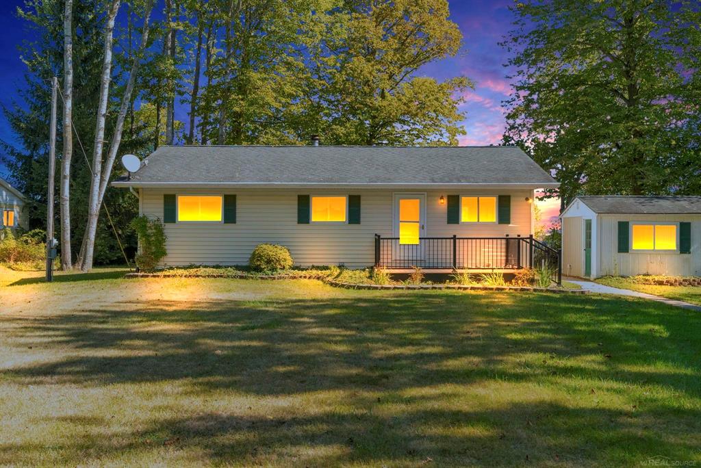 Watch the freighters from this well kept cozy home!!!! Large windows on the lake side make for a fantastic view!!!! There is a large wooden deck for entertaining and freighter watching!!! The cozy 2 bedroom is super  comfortable and waiting for you!  The crawl space has been fully encapsulated and climate controlled.   The 2+ car garage provides extra storage and the "shed" can be used for storage or extra entertaining space - Possibly a small bunk house!  This is a fantastic opportunity - it comes with a telescope for boat watching!!!  Some furniture available.