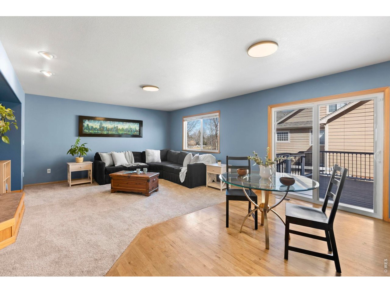 WOW!! What an opportunity! Big-ticket updates are already done: new roof (2023), HVAC system (2023), water heater (2023), many new windows (2023/2024), new siding, trim, and gutters (2024), new garage doors (2024), brand-new carpet throughout (2026), and more! PRE-INSPECTED & MOVE IN READY. Set on a large corner lot in a cul-de-sac and backing to open green space, it offers a rare mix of privacy, mountain views, and spacious living. Inside, hardwood floors and vaulted ceilings create an open, comfortable feel. The main level includes formal living and dining spaces, a family room with a double-sided fireplace, a breakfast area, half bath, and laundry room. The layout flows easily, and natural light pours in throughout the home. The kitchen is well-designed with an island, generous cabinetry, and plenty of workspace-functional for everyday living and easy for gathering. The upstairs has a beautiful primary bedroom with a walk-in closet that extends far beyond expectations, and a full bathroom with double vanity, soaking tub, and walk-in shower. The finished basement gives you flexible extra space for whatever you need, including two rooms, a full bathroom, storage, and a large recreation area. Out back, the two-level deck and large backyard with terraced garden gives you space to relax or entertain while taking in the open space behind the home. Bonus...occasionally you'll see elk passing through the neighborhood. The three-car garage provides plenty of room for vehicles, storage, and gear. Location can't be beat - conveniently located with easy access to Highway 34/Eisenhower, 1st Street, and 14th Street, making it simple to get around Loveland. Schedule your showing today! Clear pride of ownership make this Mariana Glen home stand out.