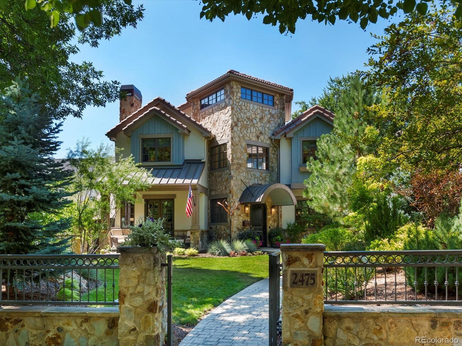 Nestled in Denver’s highly sought-after Observatory Park neighborhood, this stunning home blends timeless design with thoughtful updates. The open floor plan highlights vaulted ceilings, exposed wood beams, and stone accents, creating a warm yet refined living space that will make you feel right at home. An abundance of windows with custom treatments fills the main level with natural light, showcasing carefully curated finishes and a flowing layout connecting entertaining spaces, anchored by a spacious kitchen with ample storage and work areas. Upstairs, a serene, recently updated primary suite offers a private retreat, complemented by spacious secondary bedrooms, all with en suite bathrooms. In the basement, the full bar and dedicated movie room enhance the home’s versatility for both everyday living and hosting. Outdoors, the beautifully landscaped, fully fenced yard provides privacy and curb appeal. This property has it all with amazing proximity to Observatory Park and neighborhood favorites including dining, coffee shops, and local retail. This home offers both architectural character and the convenience of a central location in one of Denver’s most established and coveted communities.