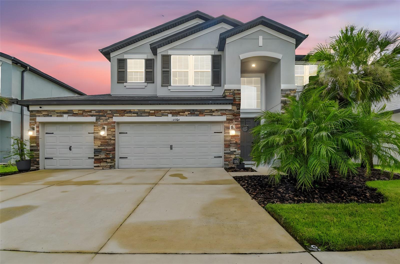 Welcome to this beautiful 5-bedroom, 3-bathroom home in one of Wesley Chapel’s most sought-after gated communities! Designed with both comfort and practicality in mind, this home offers plenty of space for the whole family to enjoy.
The main floor features a large formal dining room, a cozy electric fireplace with accent walls, and a bedroom with a full bath—perfect for guests or multi-generational living. You’ll also love the under-stair storage and the clever built-in dog kennel for your four-legged family members.
Upstairs, a huge living area is the ideal hangout spot for movie nights, game days, or playtime. The spacious master suite provides a relaxing retreat with plenty of room to unwind.
Outside, the fun continues with a big fenced backyard and a screened-in lanai, perfect for barbecues, birthday parties, or simply enjoying Florida evenings. The rare 4-car garage gives you plenty of space for vehicles, storage, or hobbies.
Living here means more than just a house—it’s a community. Enjoy the resort-style pool, dog park, and kids’ playground, all inside the gates. Plus, you’re right across the street from top-rated schools and just minutes from the interstate, Epperson Lagoon, Target, Walmart, Krate at the Grove, and everything else Wesley Chapel has to offer.
This home has it all—space, convenience, and a welcoming community. All that’s missing is you!