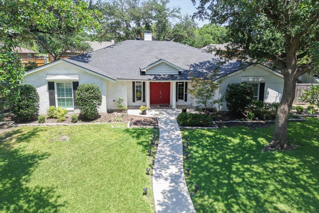 RV OWNERS! Don't miss this gem! Rare one third acre cul-de-sac lot with 40 foot concrete RV pad, including 50 AMP and full hookups, outdoor living area and workshop. Nestled in central Plano, this 4 bedroom, 2.5 bath home offers an open floor plan with two expansive living areas connected by a see-through gas fireplace. The updated kitchen is a chef's dream with large quartz island, gas cooktop, double convection ovens with air fryer, French door refrigerator & a spacious pantry. Adjacent dining area includes a stunning chandelier and built in buffet. The split bedroom layout ensures privacy, with ample space for family, guests or a home office. Step outside to your private outdoor oasis complete with covered living area, a wood burning stone fireplace, built in grill with warming drawer & 2 burners. Automated full cover electric shades provide year-round enjoyment. A fully fenced backyard also boasts a separate workshop with AC, ideal for hobbies or storage. Driveway recently replaced and second parking pad added. Hot water circulating system for instant hot water at kitchen and baths & a reverse osmosis filter at the bar sink. Foundation repaired with transferrable warranty. AC 2020, WH 2023, Fence 2021, drip irrigation system & security lighting. Maytag washer and dryer included